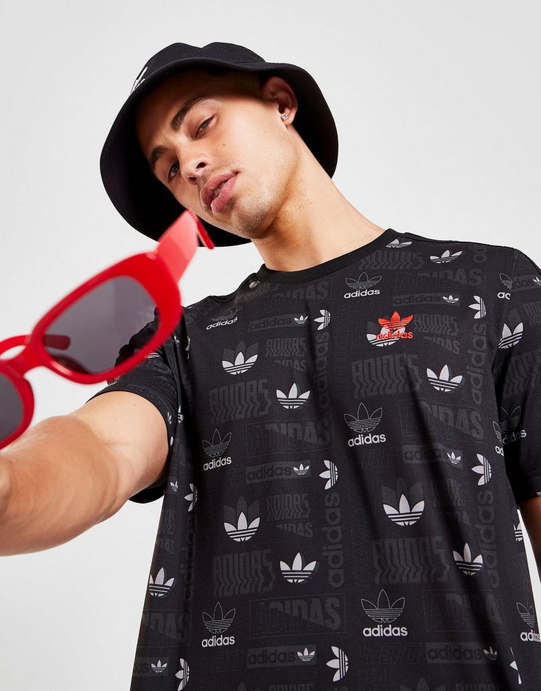 Koszulka, t-shirt męski ADIDAS KRÓTKI RĘKAW STICKER ALL OVER PRINT T-SHIRT HM6220 Czarny