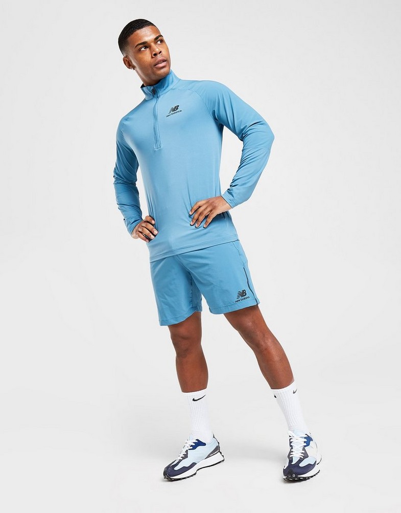Krótkie spodenki, szorty męskie NEW BALANCE SZORTY WOVEN SHORTS MS21600SGD Niebieski