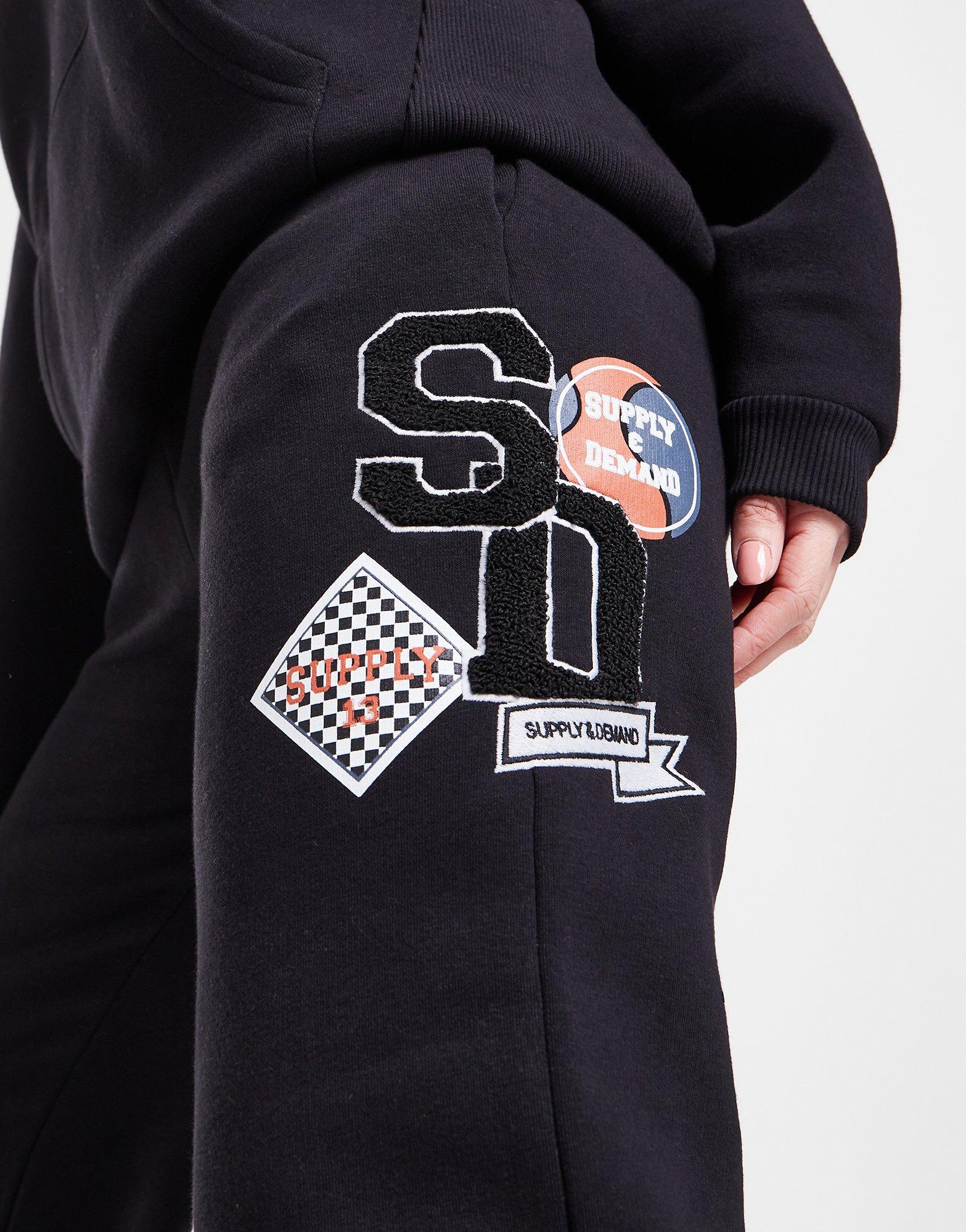 Dámske nohavice SUPPLY & DEMAND NOHAVICE  LOGO BADGE JOGGERS SUPTW16023BLK Čierna