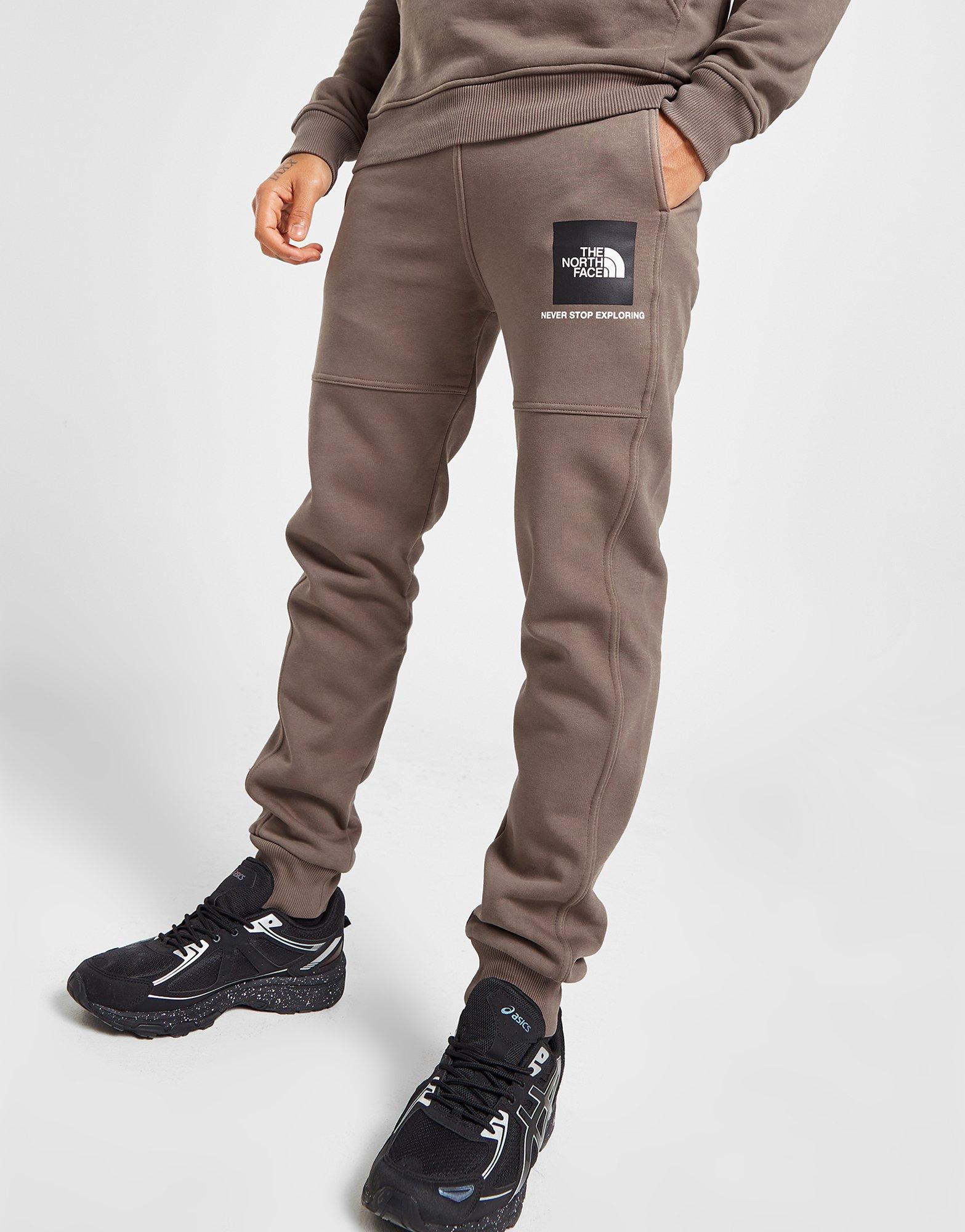 Pánske nohavice THE NORTH FACE TRENINGOWE FINE BOX JOGGERS NF0A5IILNXL1 Hnedá