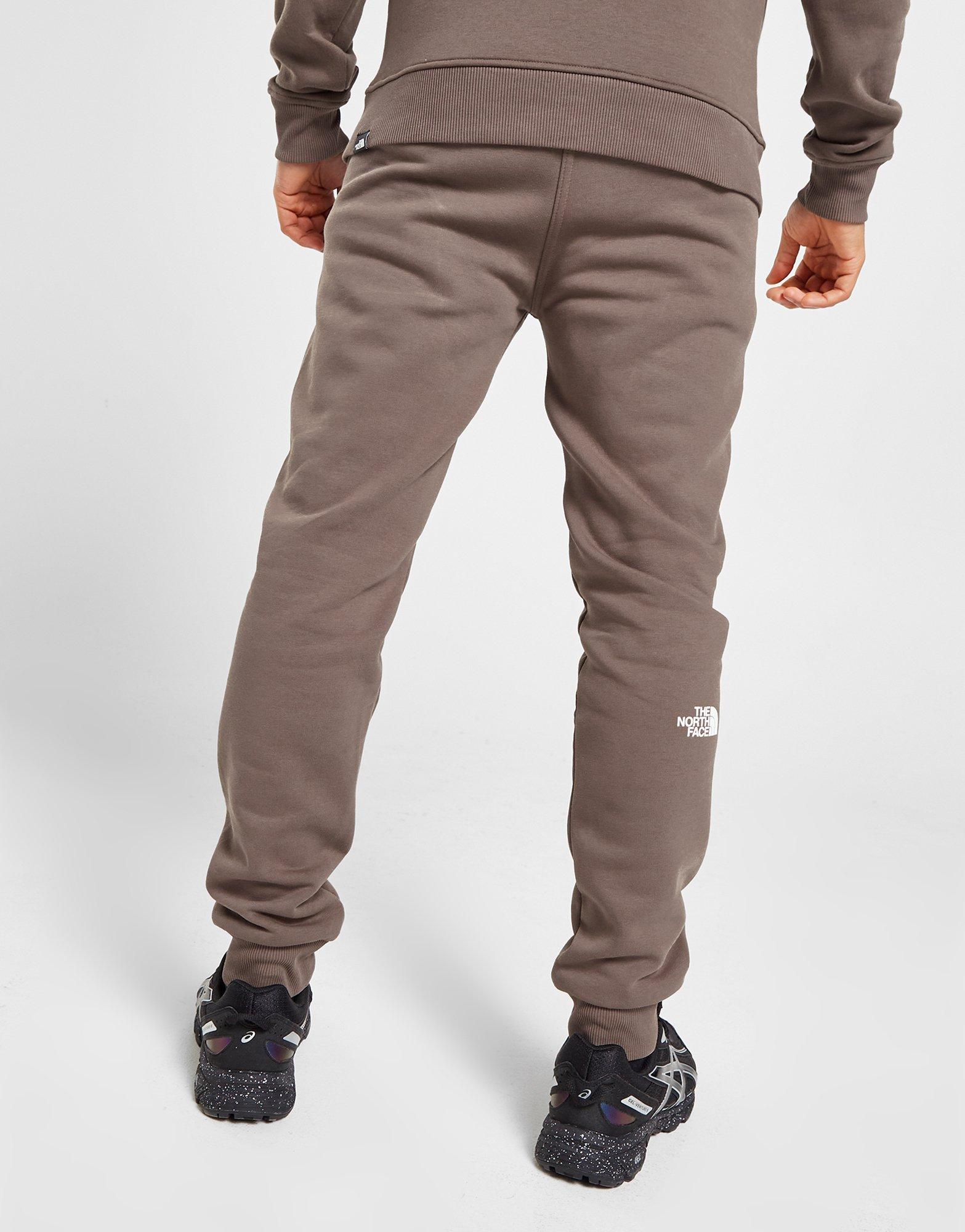 Pánske nohavice THE NORTH FACE TRENINGOWE FINE BOX JOGGERS NF0A5IILNXL1 Hnedá