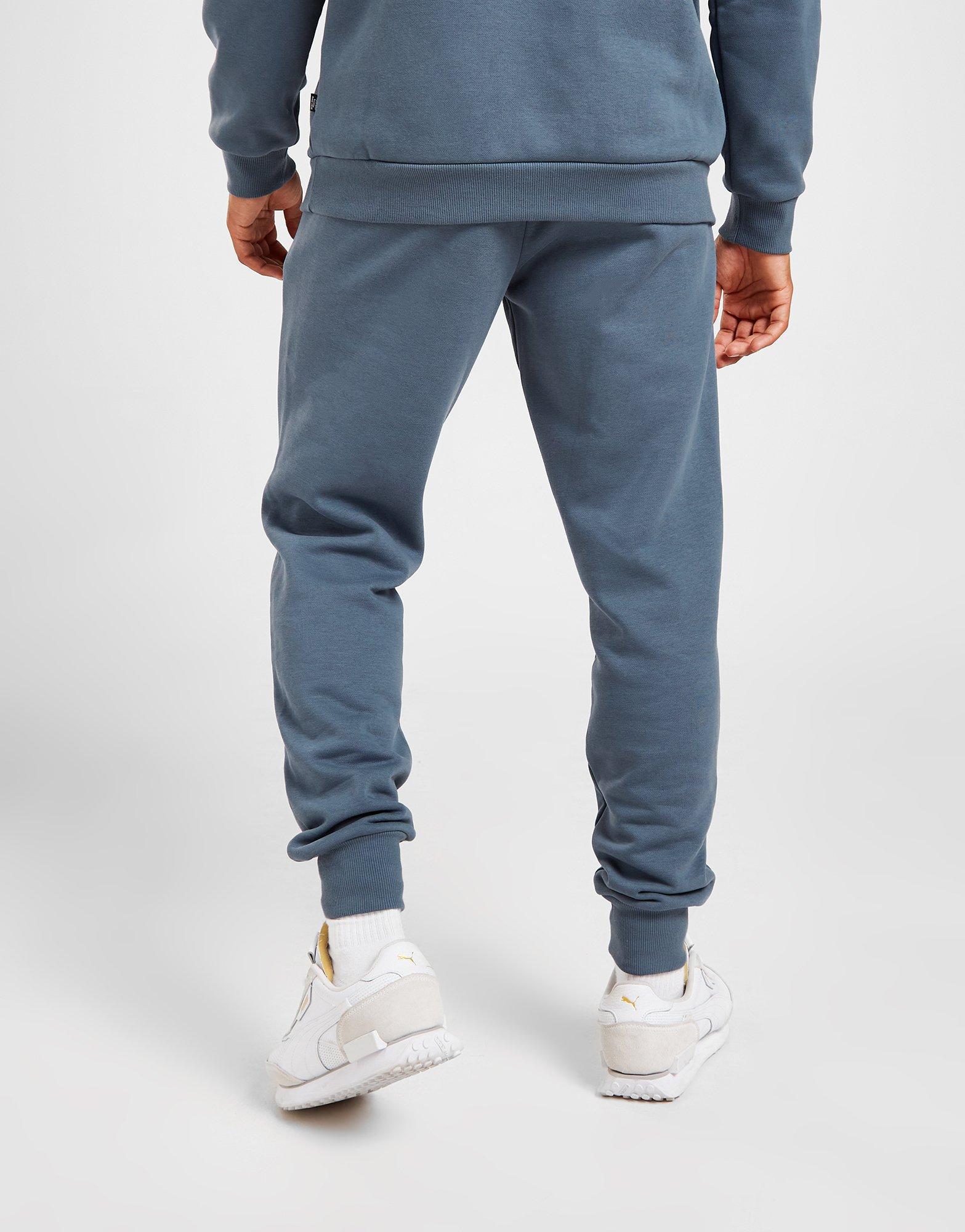 Pánske nohavice PUMA  NOHAVICE  CORE FLEECE JOGGERS 58671510 Modrá