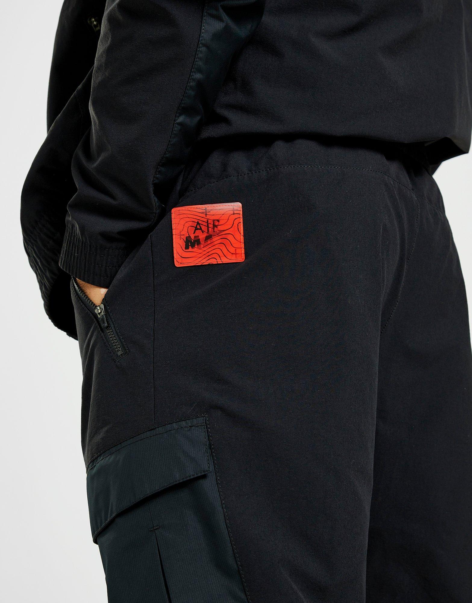 Pánske nohavice NIKE NOHAVICE  MAX WVN CARGO BLK DV2336-010 Čierna