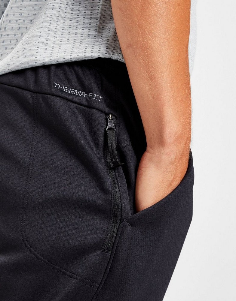 Pánské kalhoty NIKE KALHOTY  M NK TF PANT TAPER DQ5405-010 Černá