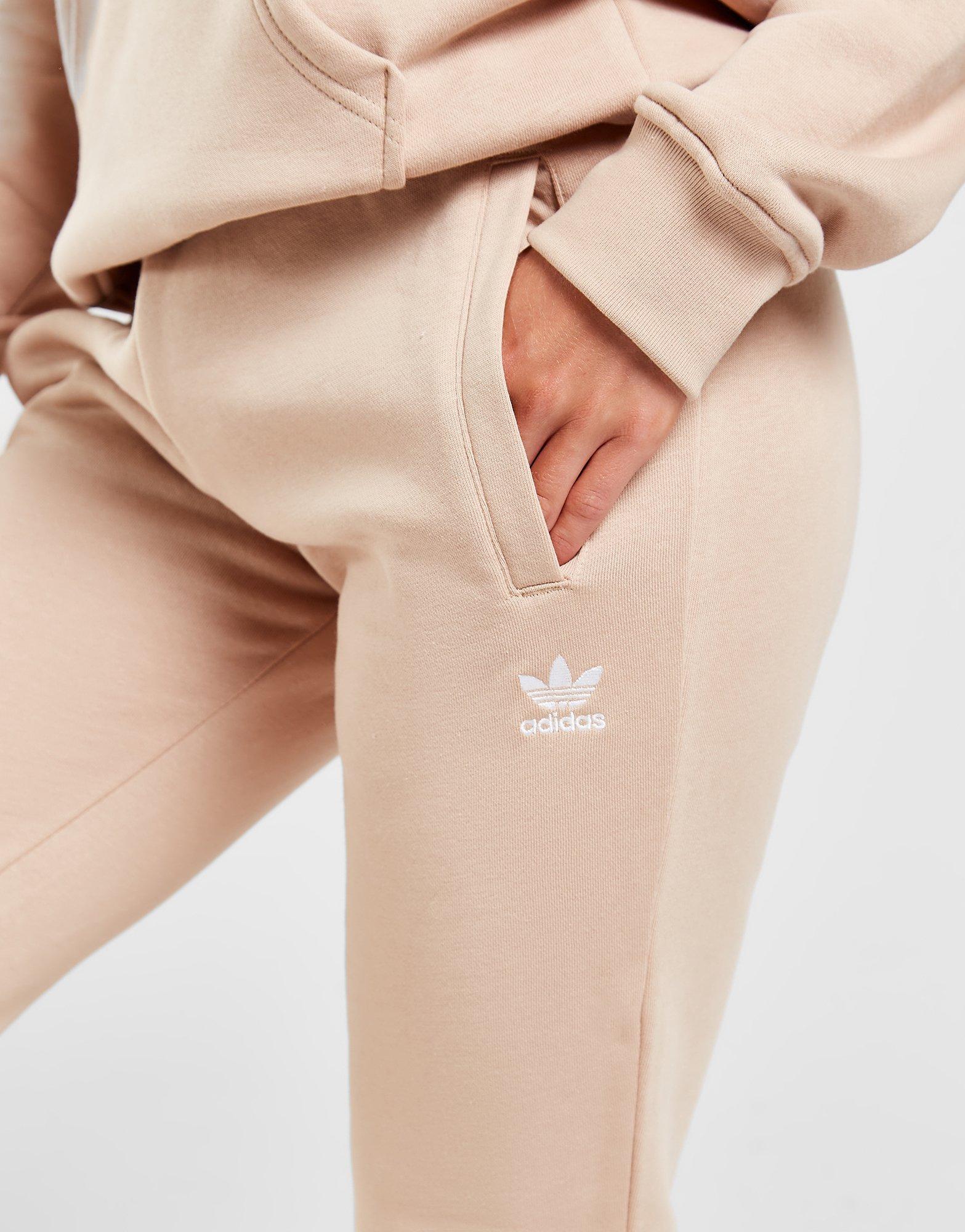 Dámske nohavice ADIDAS ESSENTIAL SLIM JOGGERS  HJ7850 Béžová