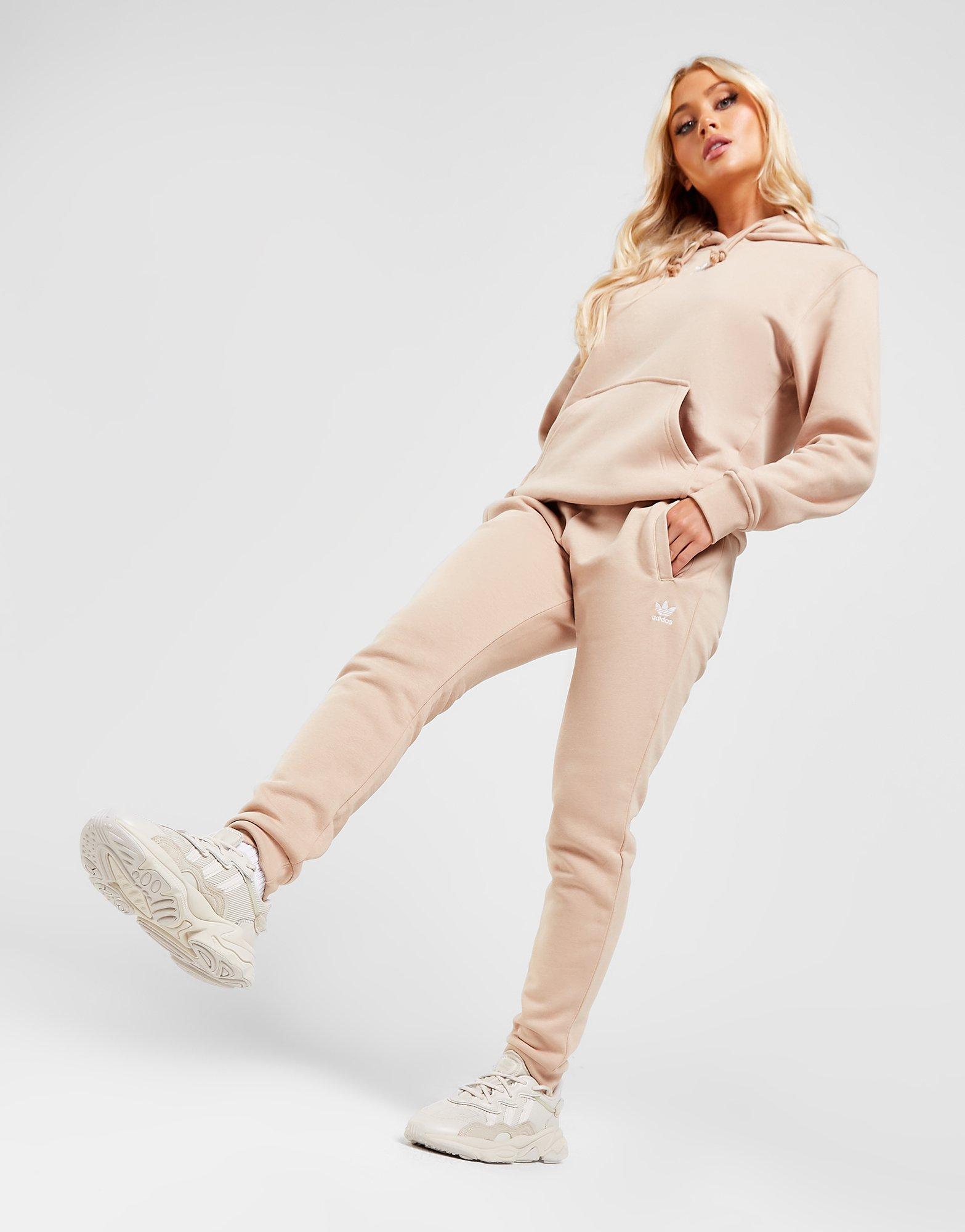 Dámske nohavice ADIDAS ESSENTIAL SLIM JOGGERS  HJ7850 Béžová