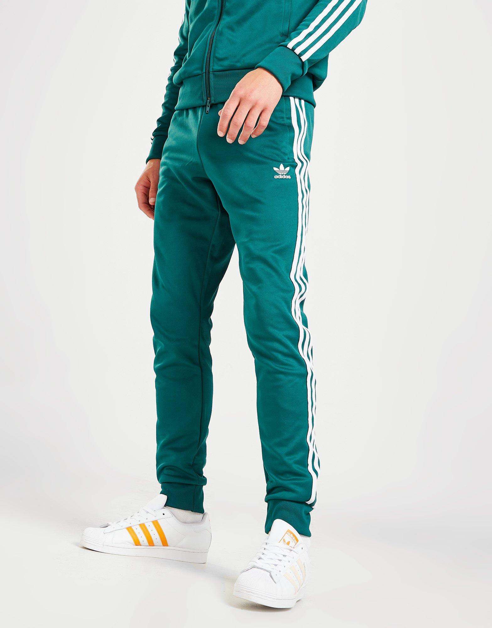 Pánske nohavice ADIDAS SUPERSTAR TRACK PANTS IC4515 Zelená