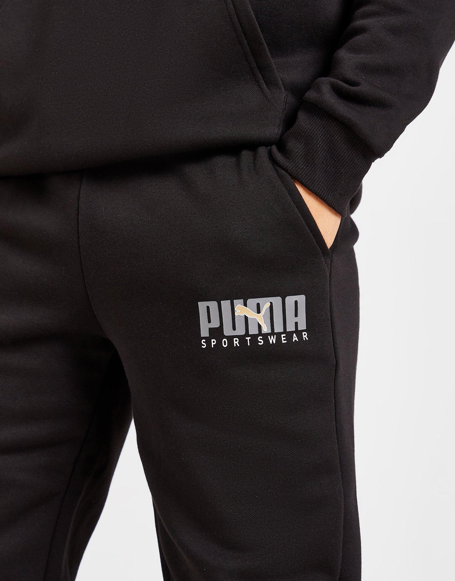 Vyriškos kelnės PUMA KELNĖS CORE SPTSW PANTS BLK/GLD 67488601 Juoda