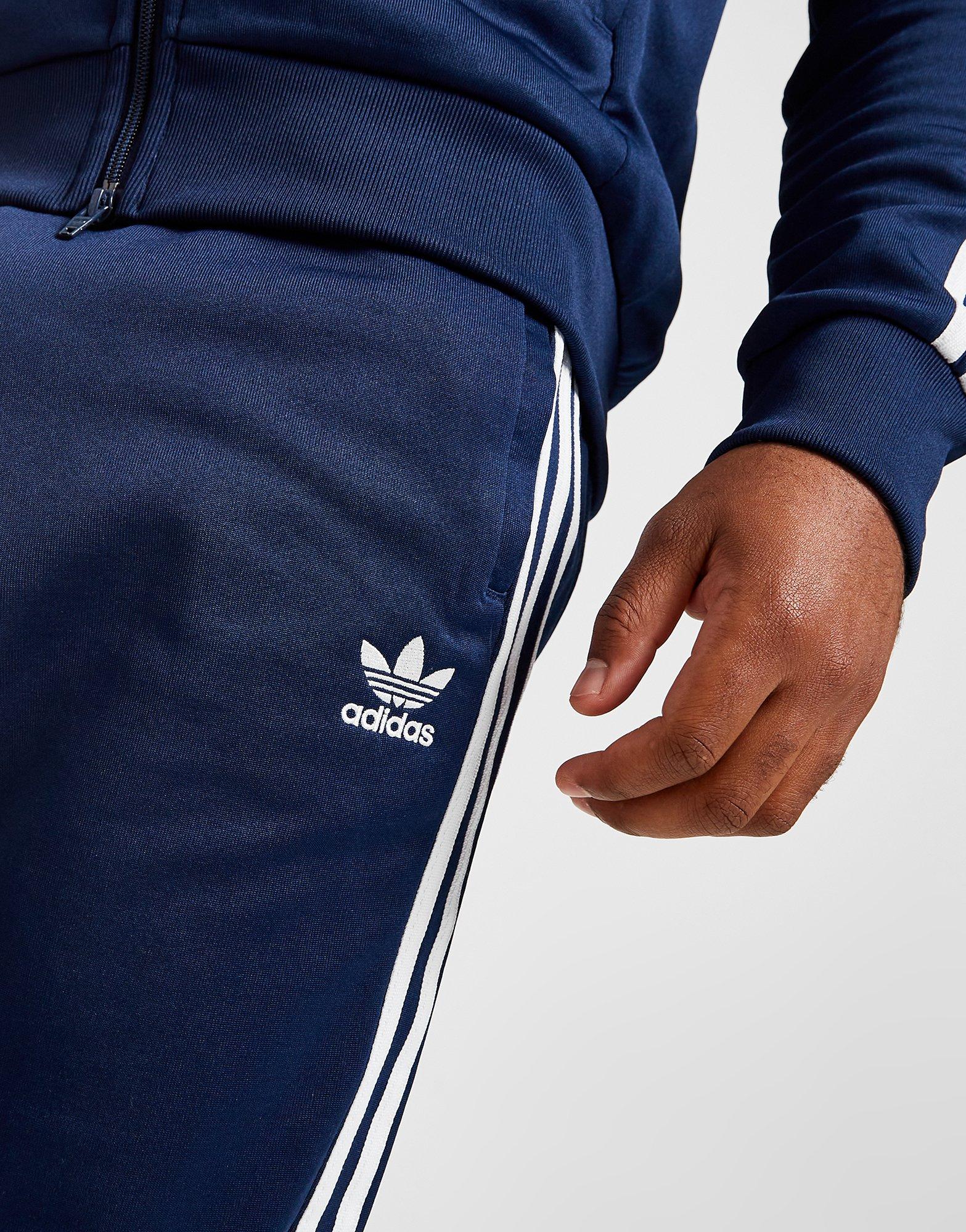 ADIDAS SPODNIE SST TP P BLUE HK7353 Granatowy