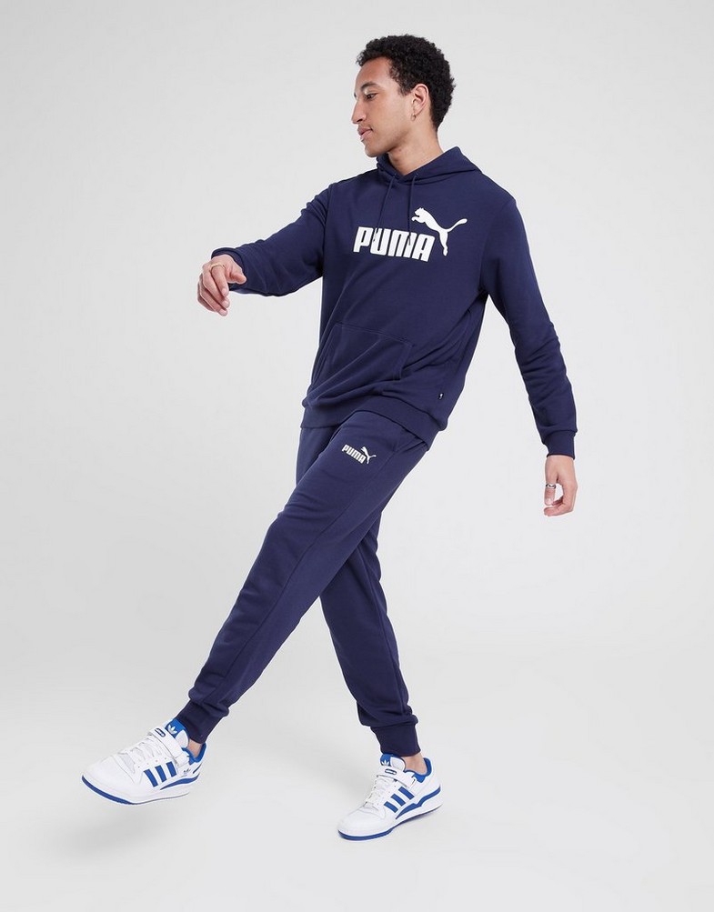 Pánské kalhoty PUMA KALHOTY  ESS LOGO PANTS TR CL 58671606 Tmavě modrá
