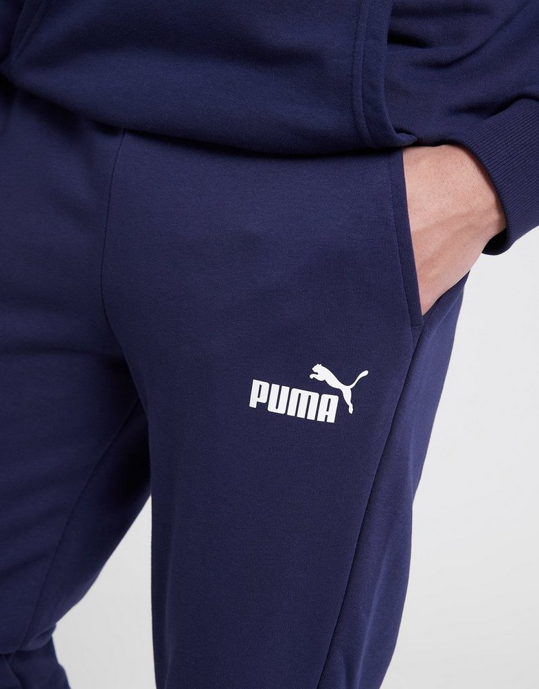 Pánské kalhoty PUMA KALHOTY  ESS LOGO PANTS TR CL 58671606 Tmavě modrá