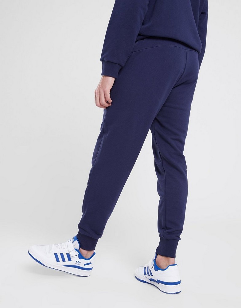 Pánské kalhoty PUMA KALHOTY  ESS LOGO PANTS TR CL 58671606 Tmavě modrá