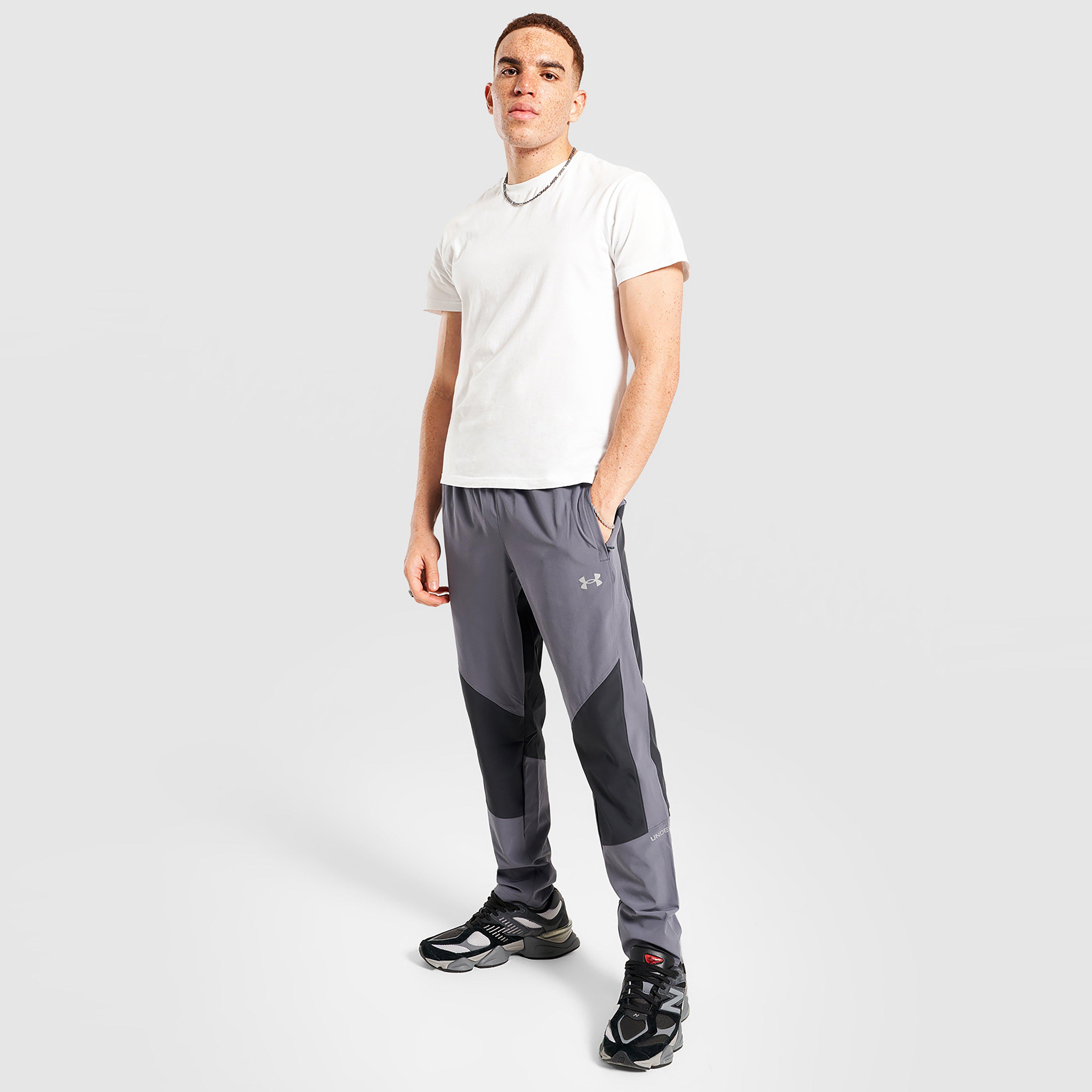 Férfi melegítőnadrág és jogger UNDER ARMOUR NADRÁG TECH HYBRID WVN PANTS