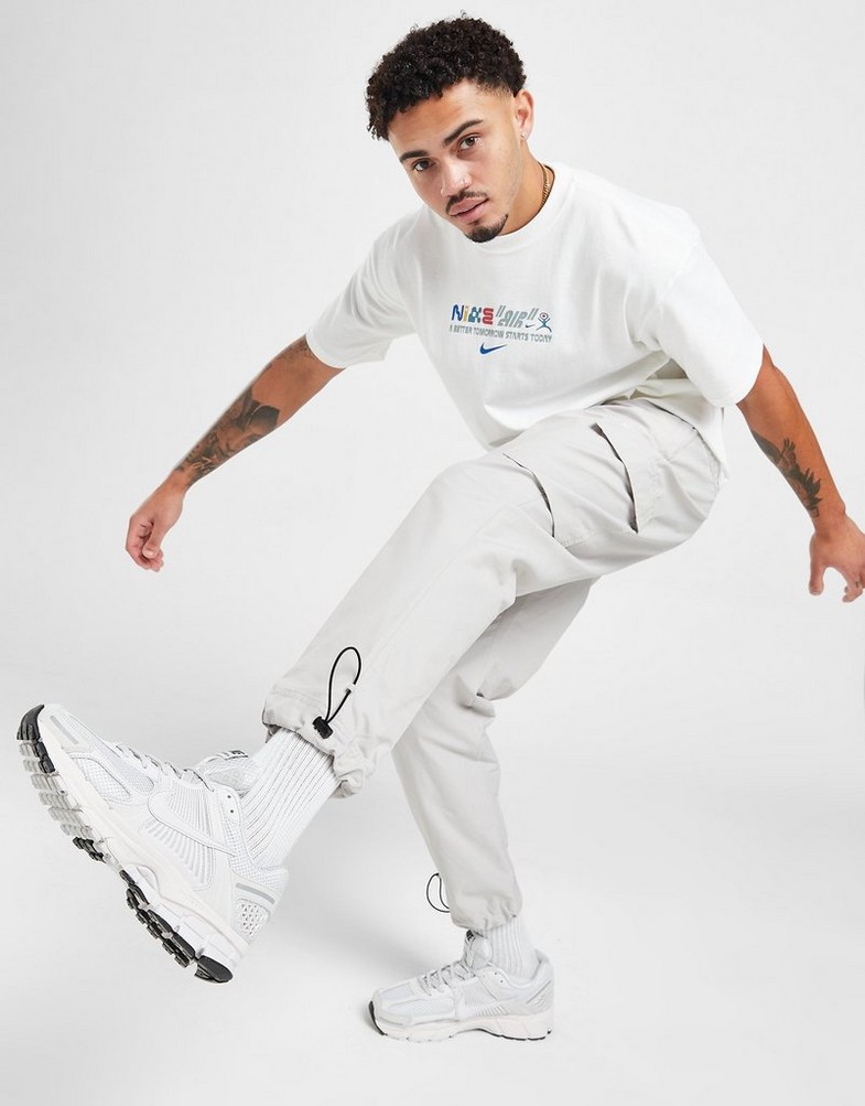 NIKE SPODNIE PLAYER WVN PANT LT ORE PANTS DX2033-012 Beżowy