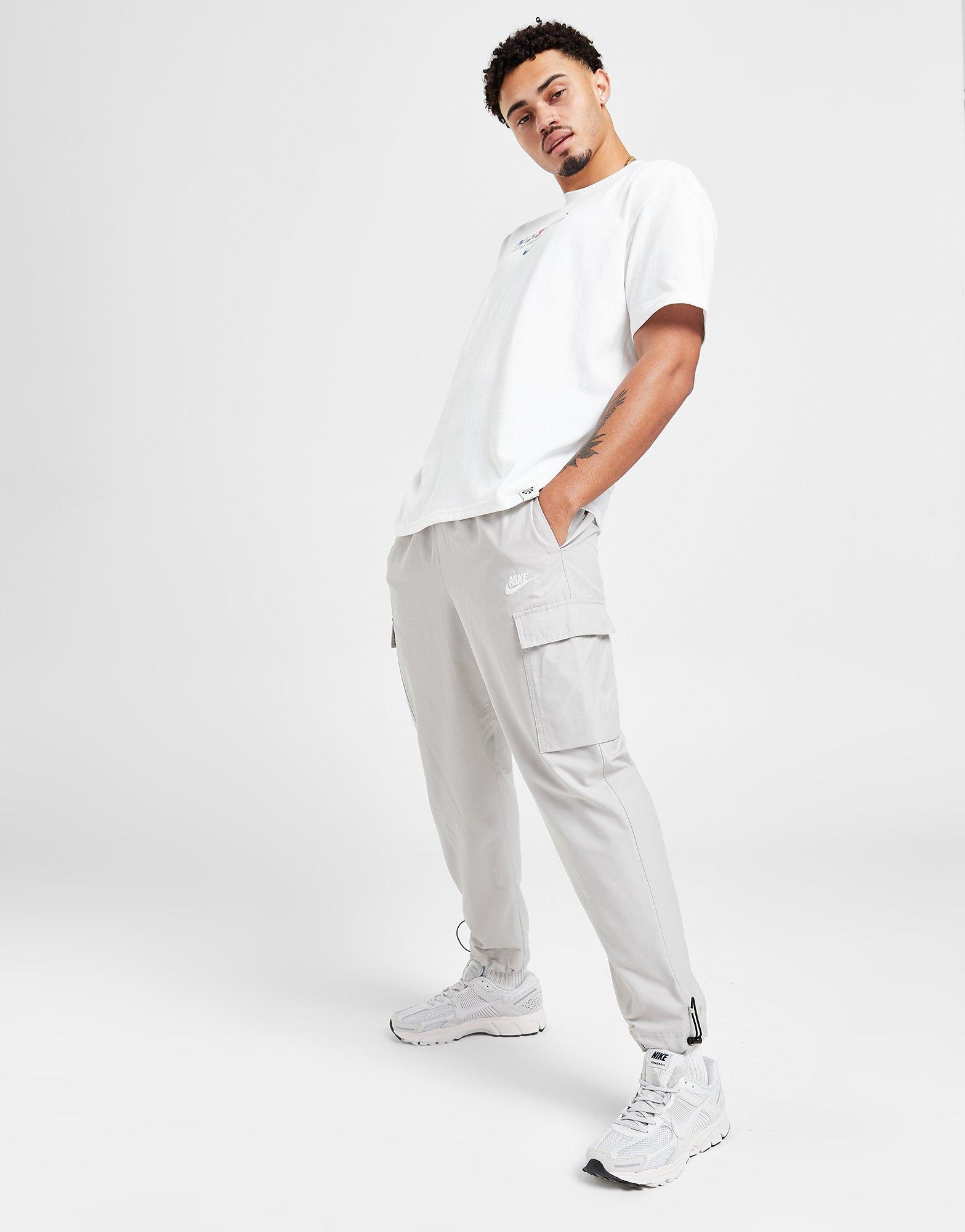 Vyriškos kelnės NIKE KELNĖS PLAYER WVN PANT LT ORE PANTS DX2033-012 Rusva