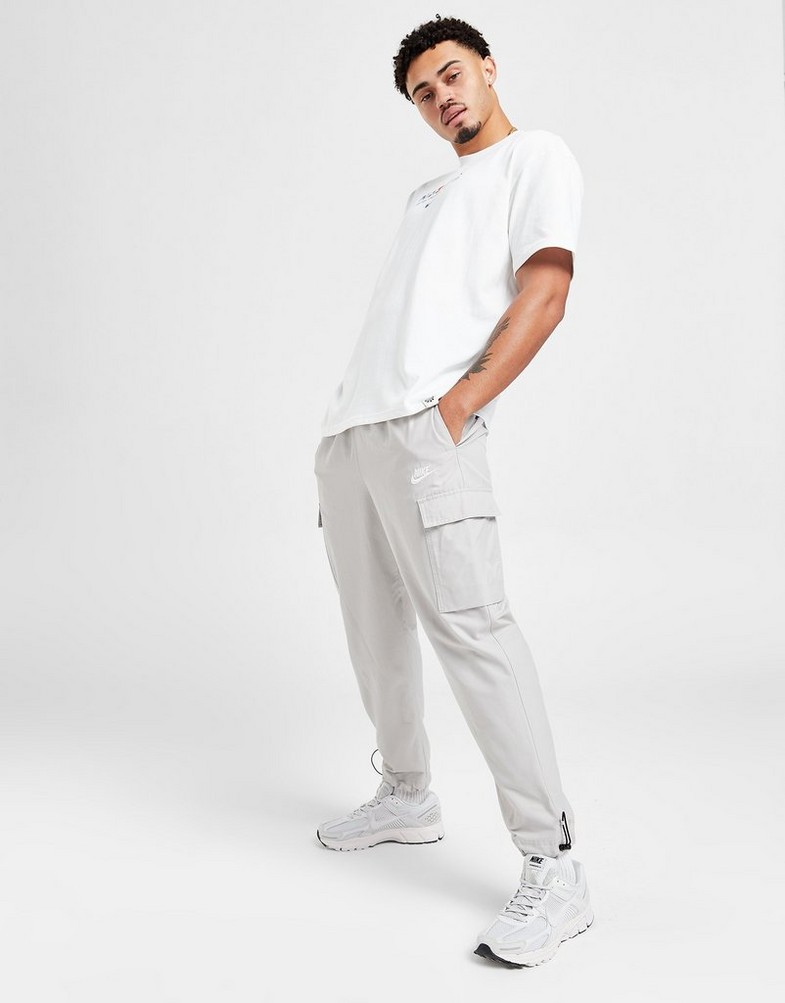 NIKE SPODNIE PLAYER WVN PANT LT ORE PANTS DX2033-012 Beżowy