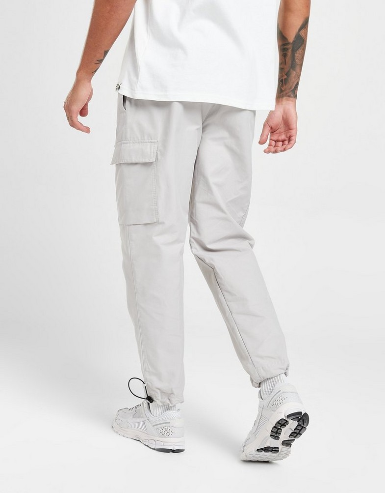 NIKE SPODNIE PLAYER WVN PANT LT ORE PANTS DX2033-012 Beżowy