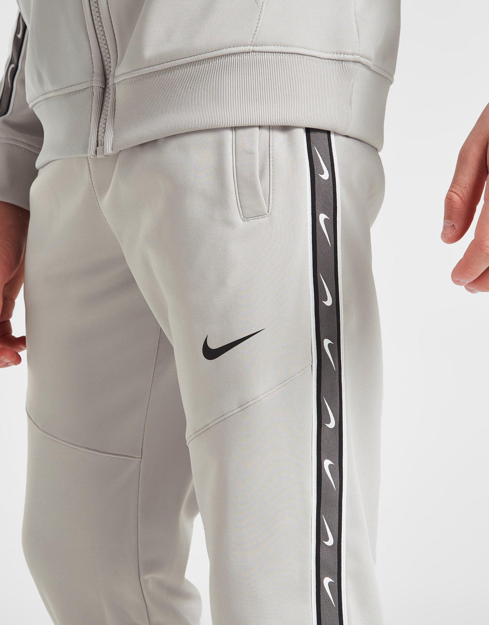 Vaikiškos kelnės NIKE KELNĖS B NSW REPEAT SW PK JOGGER B DZ5623-012 Pilka