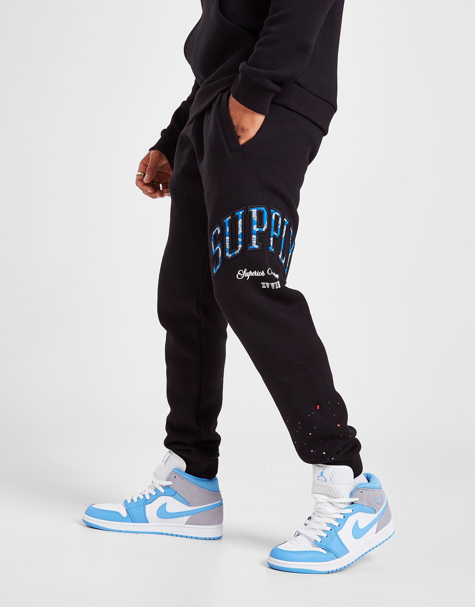 Vyriškos kelnės SUPPLY&DEMAND KELNĖS TEAM SPLATTER JOG PANTS BLAC SUPTM16369 Juoda