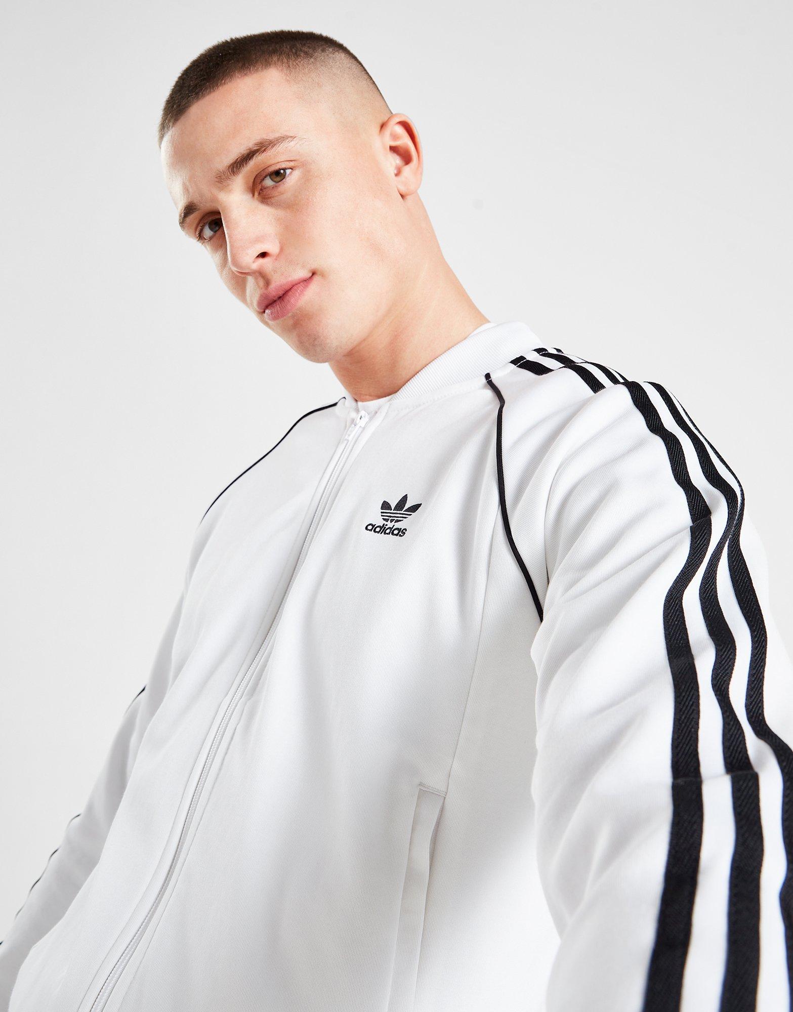 Bluza męska ADIDAS BLUZA Z KAPTUREM SST TRACKTOP PRIME BLUE IP7145 Biały