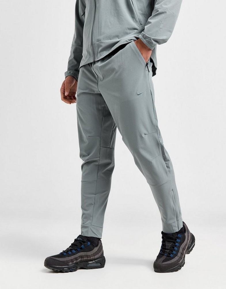 NIKE SPODNIE M NK DF UNLIMITED PANT TPR