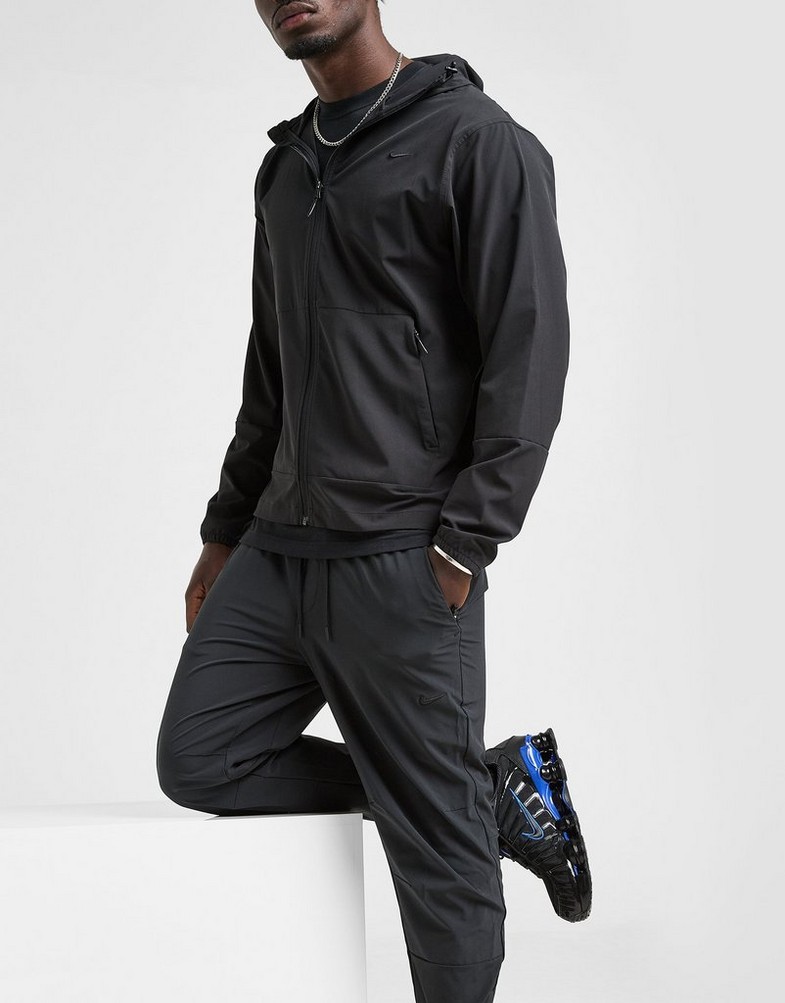 NIKE NADRÁG M NK DF UNLIMITED PANT TPR FB7548-010 Fekete