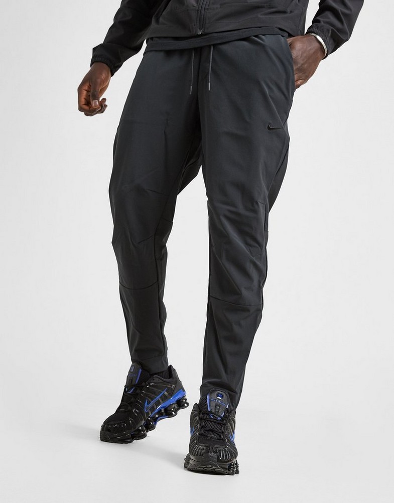 NIKE NADRÁG M NK DF UNLIMITED PANT TPR FB7548-010 Fekete