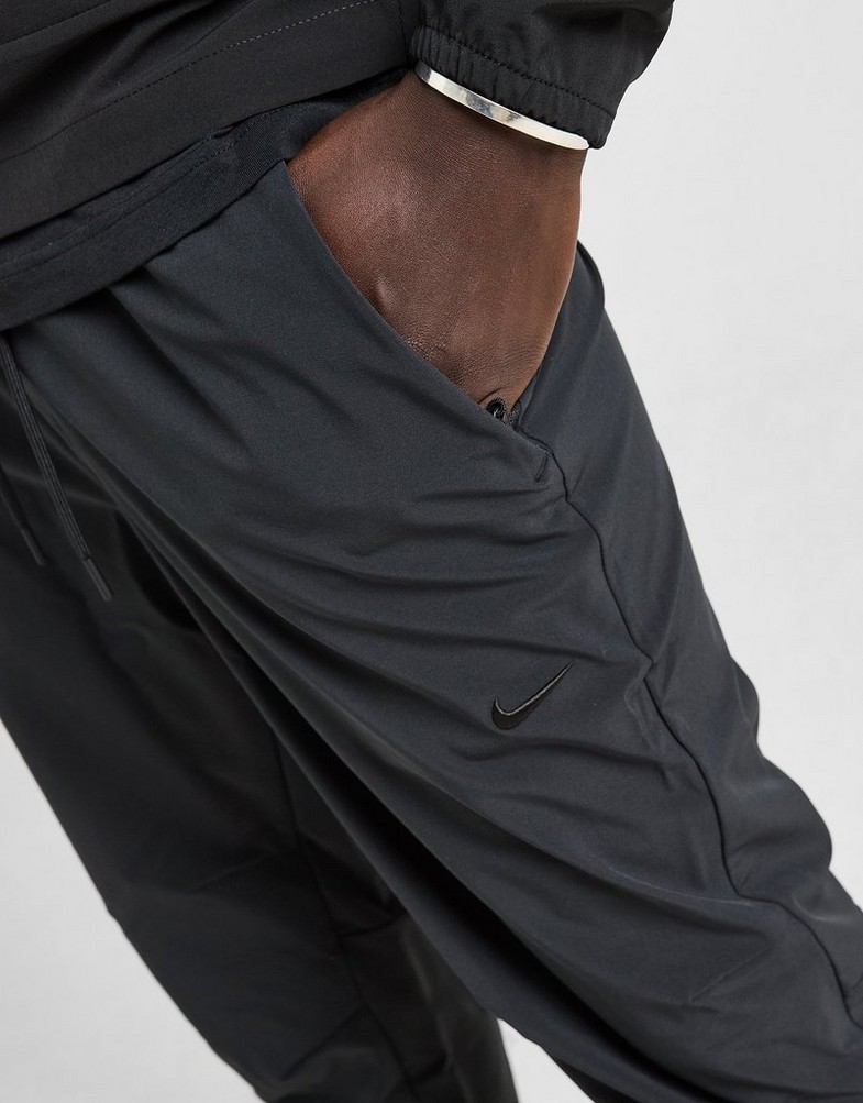 NIKE NADRÁG M NK DF UNLIMITED PANT TPR FB7548-010 Fekete