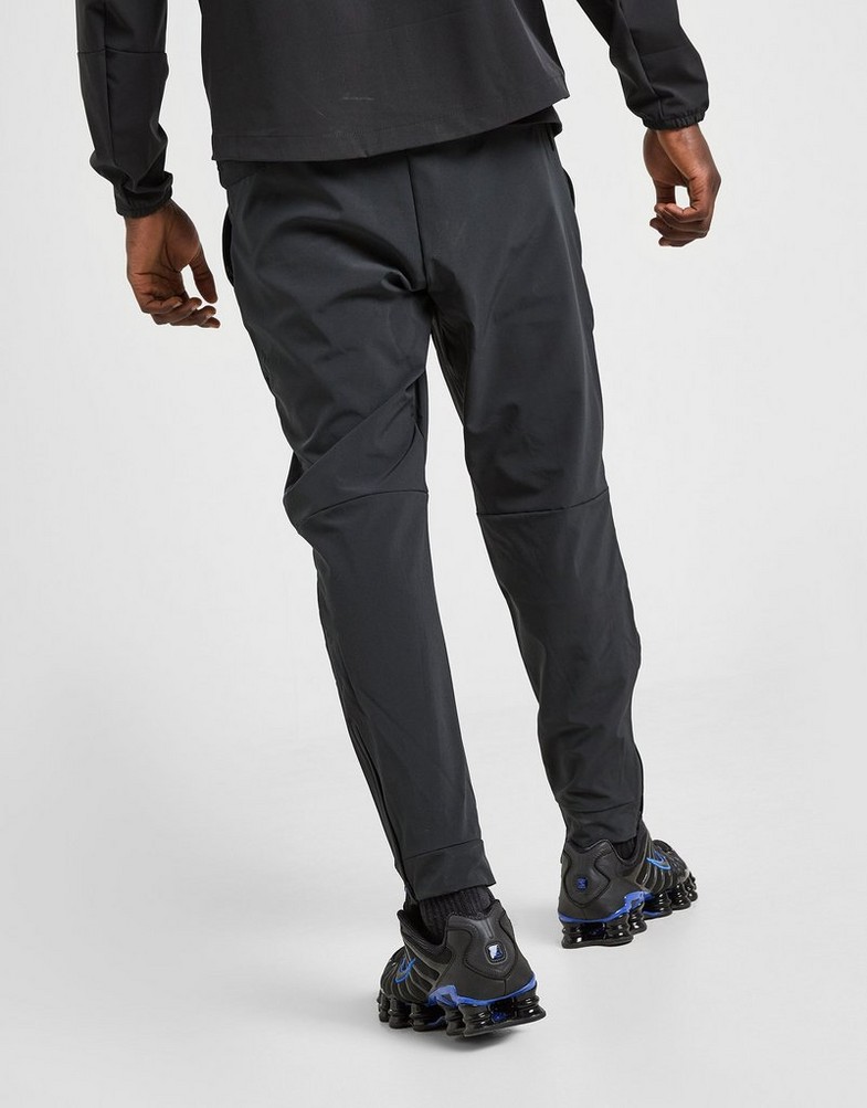 NIKE NADRÁG M NK DF UNLIMITED PANT TPR FB7548-010 Fekete