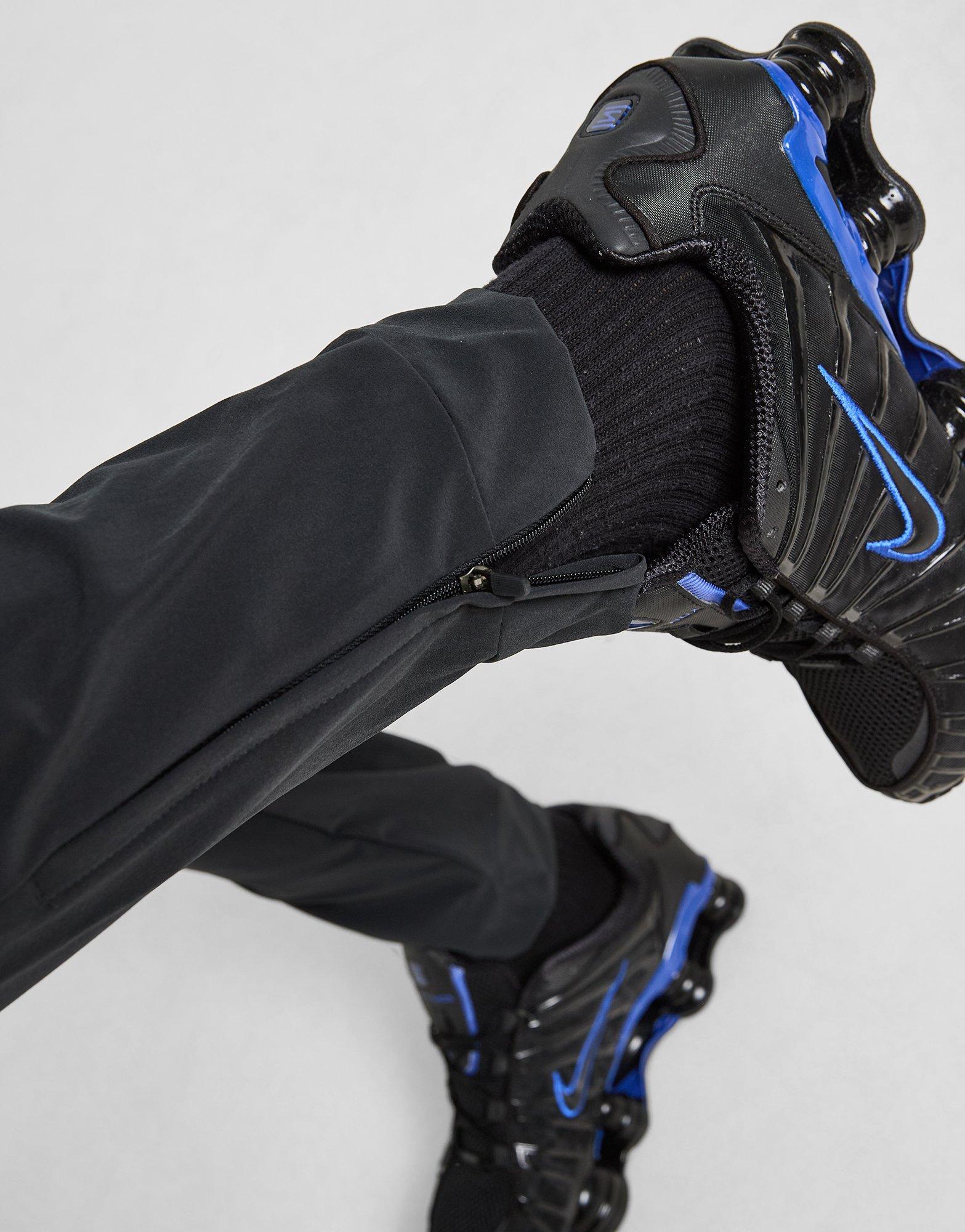 Pánské kalhoty NIKE KALHOTY  M NK DF UNLIMITED PANT TPR FB7548-010 Černá