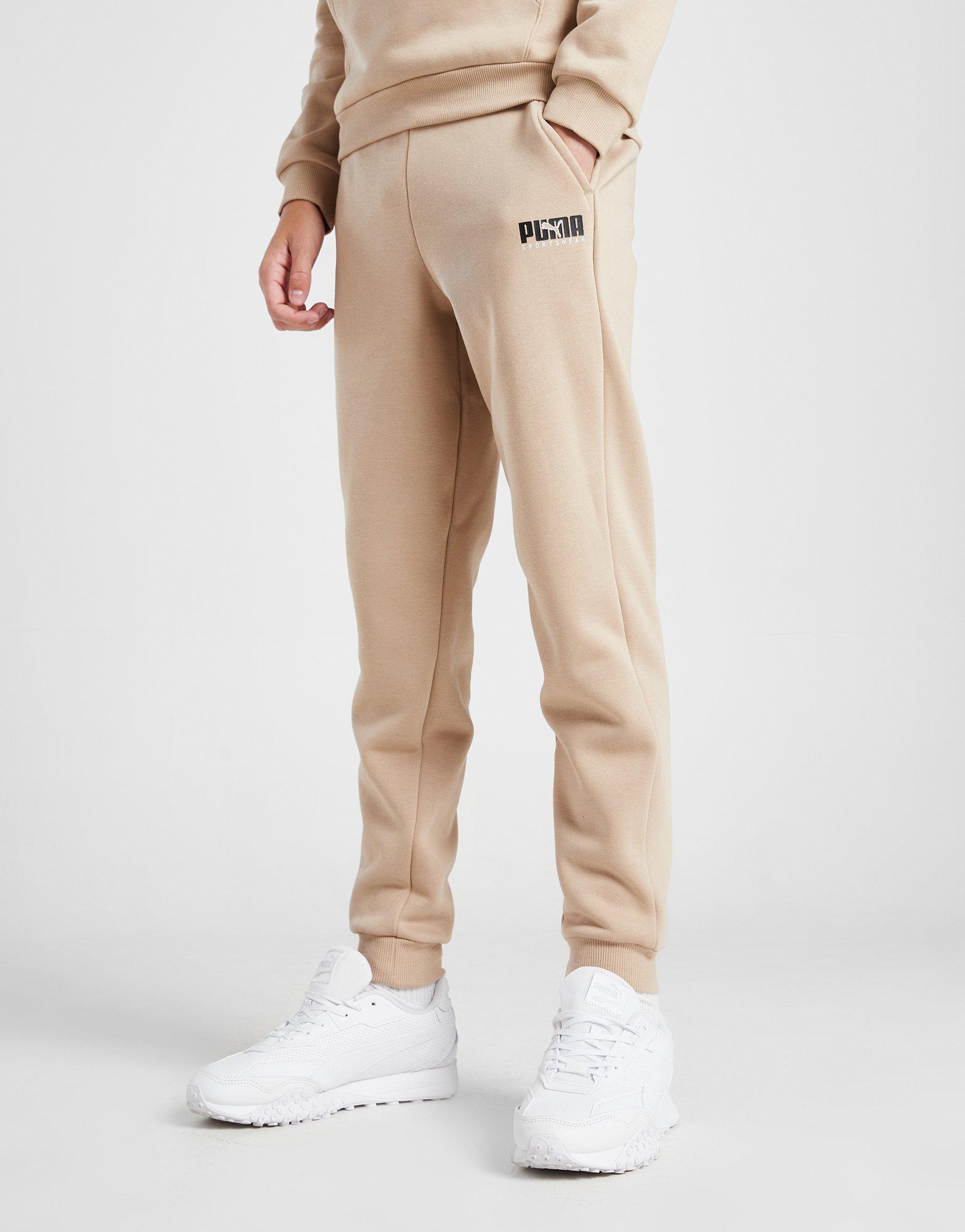 Дитячі штани PUMA ШТАНИ KEY GRAPHIC PANT B F L 67508830 Бежевий