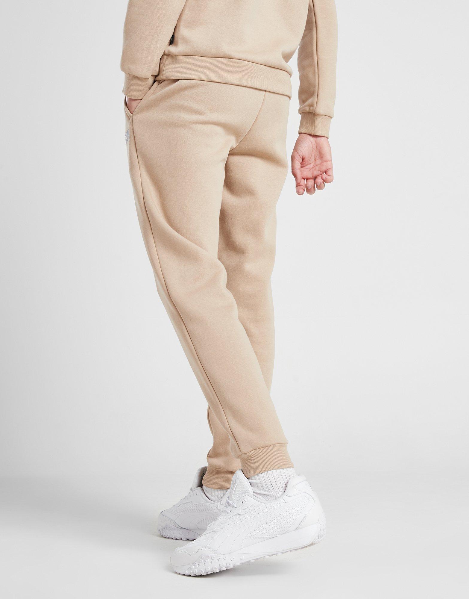Дитячі штани PUMA ШТАНИ KEY GRAPHIC PANT B F L 67508830 Бежевий