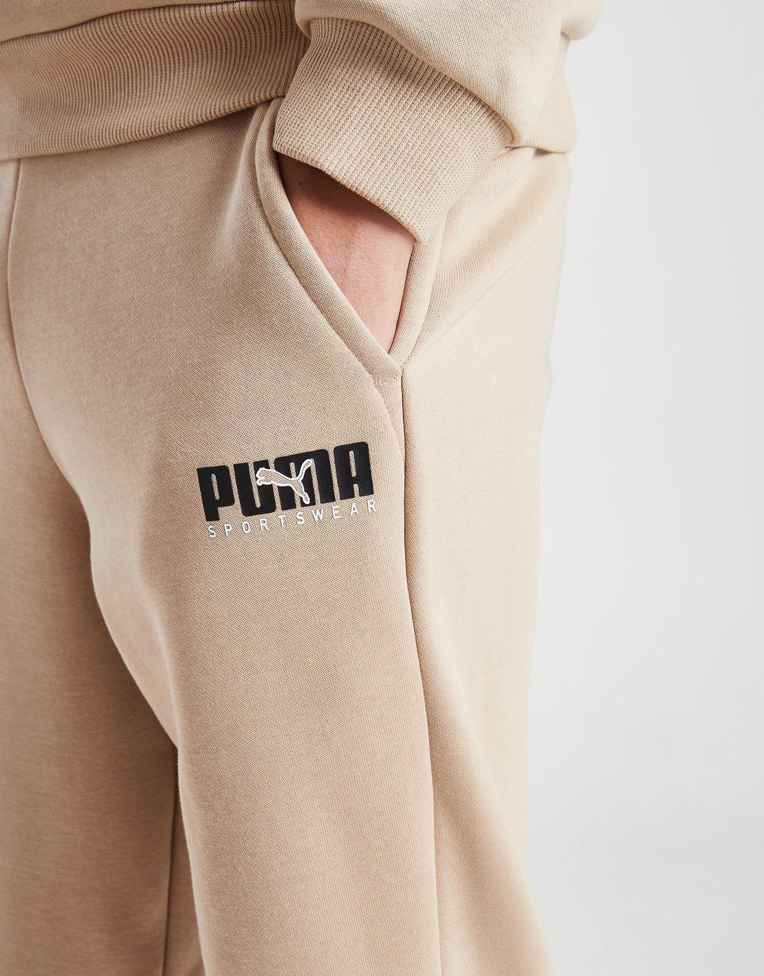 Дитячі штани PUMA ШТАНИ KEY GRAPHIC PANT B F L 67508830 Бежевий