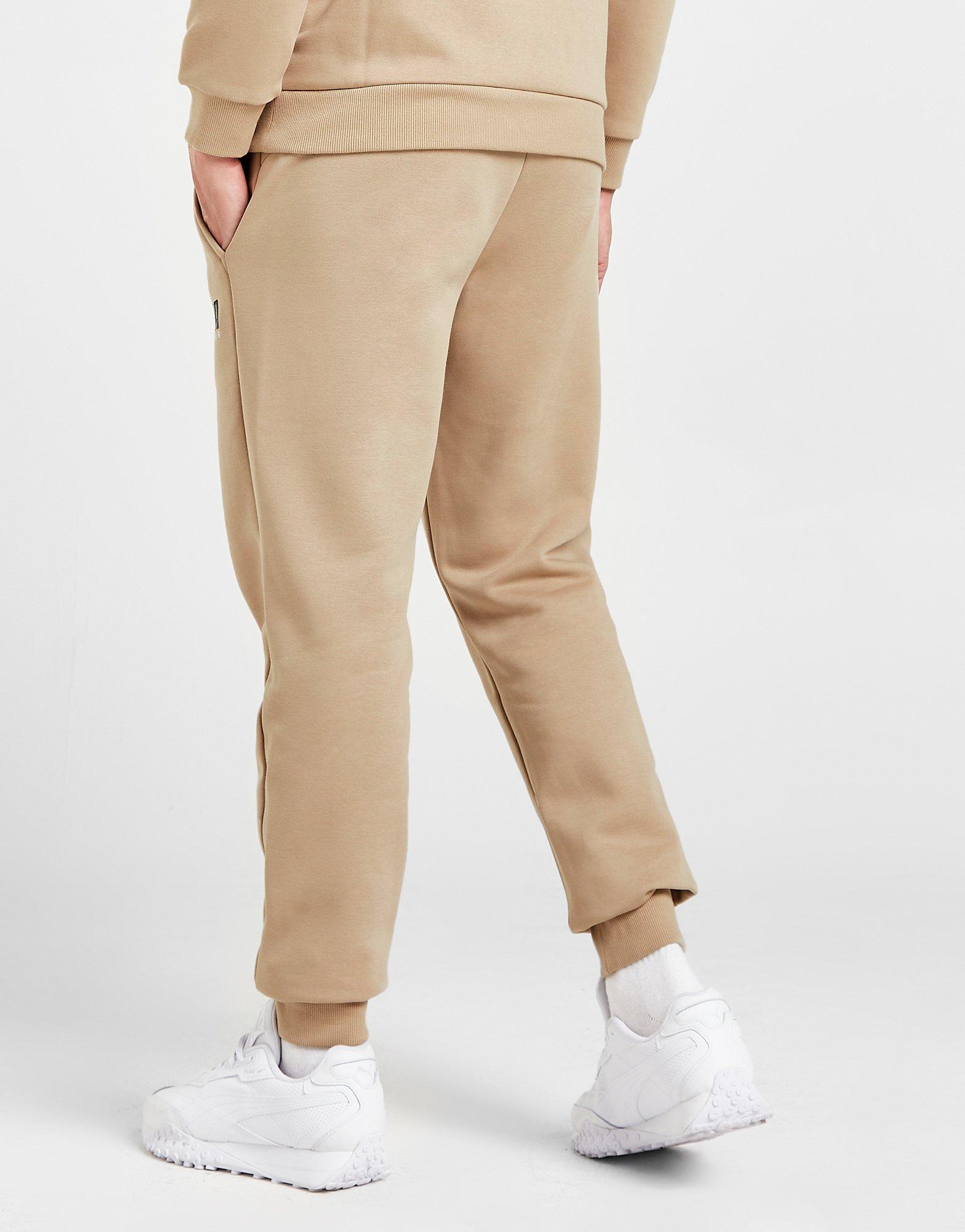 PUMA SPODNIE KEY GRAPHIC PANTS FL 62303630 Beżowy