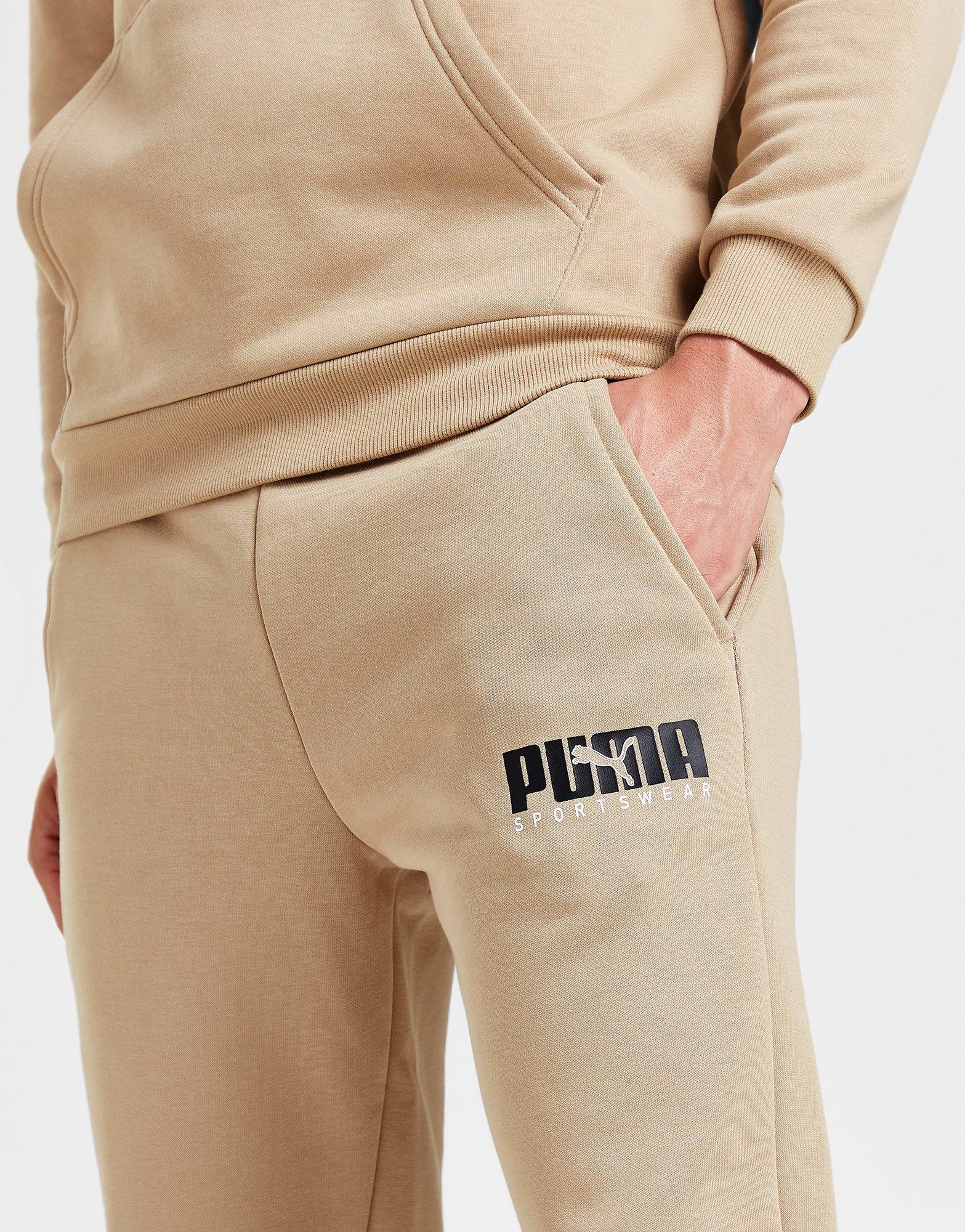 PUMA SPODNIE KEY GRAPHIC PANTS FL 62303630 Beżowy