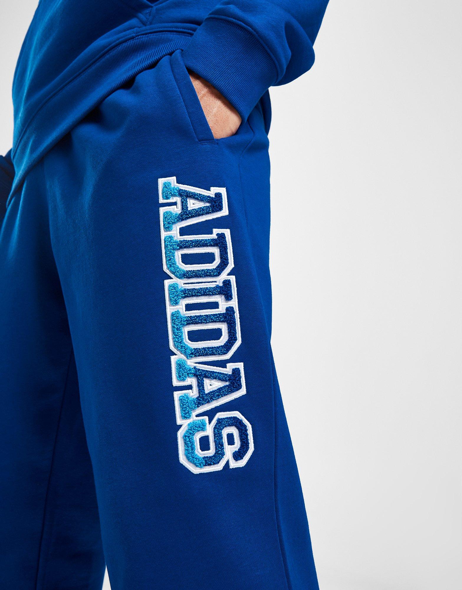 Pánské kalhoty ADIDAS KALHOTY  GRADIENT PANT BLU IR9669 Modrá