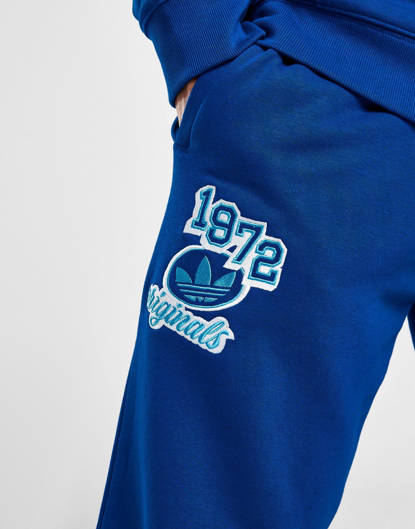 Pánské kalhoty ADIDAS KALHOTY  GRADIENT PANT BLU IR9669 Modrá