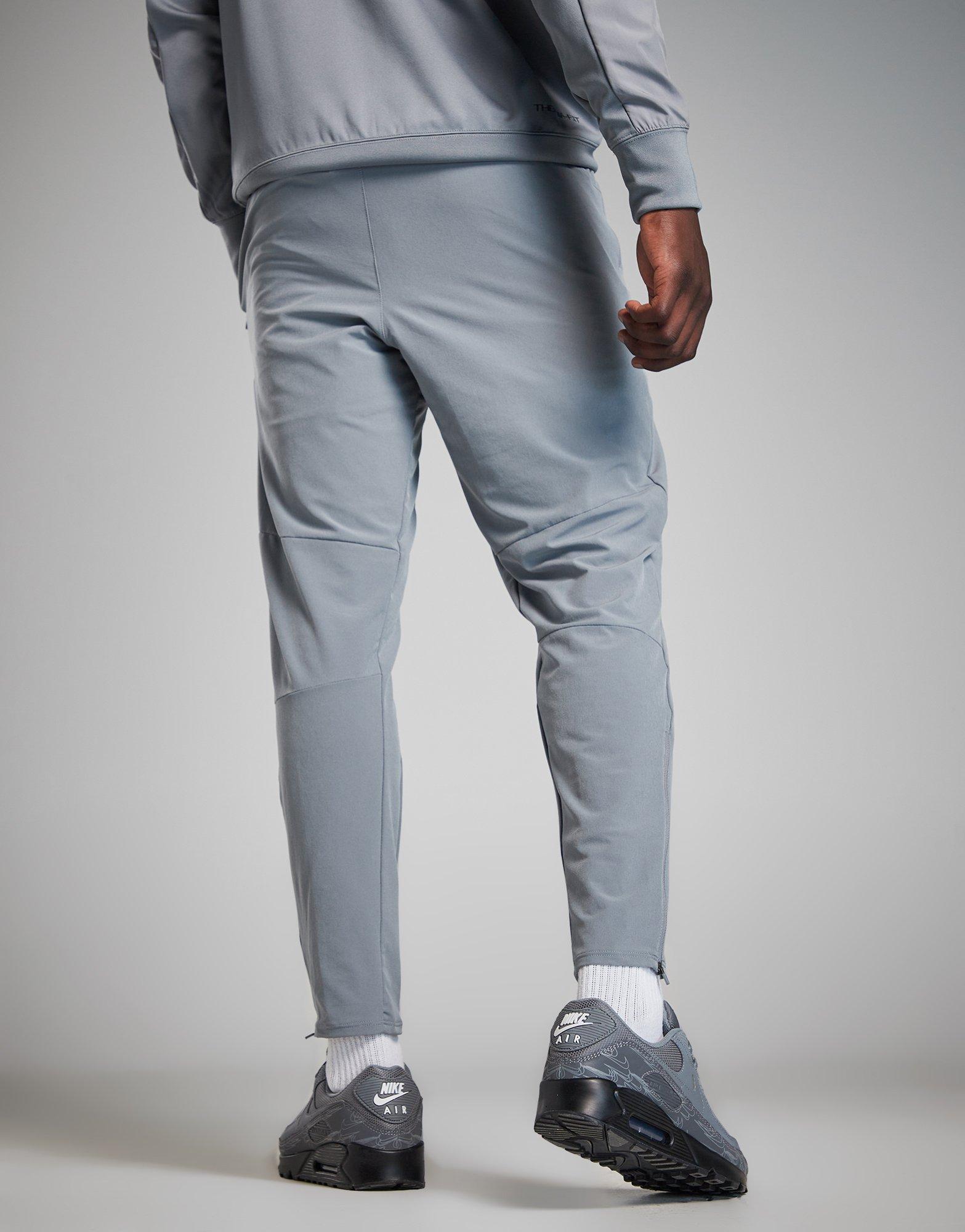 Pantaloni pentru bărbați NIKE PANTALONI  M NSW AIR MAX TC WV PANT FQ2207-065 Gri