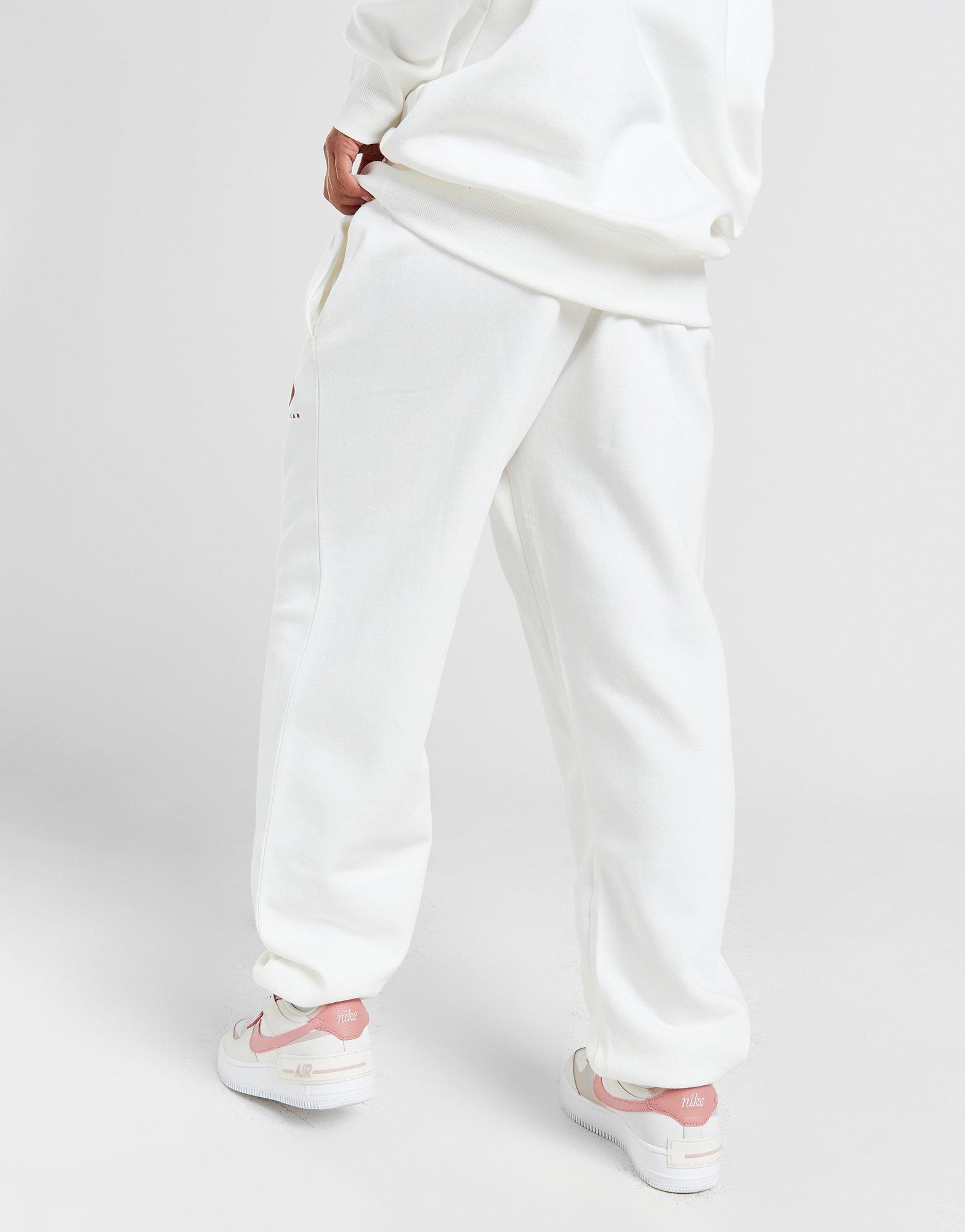 Dámské kalhoty NIKE KALHOTY  NSW PHNX FLC HR OS PANT PRNT FN7716-133 Béžová