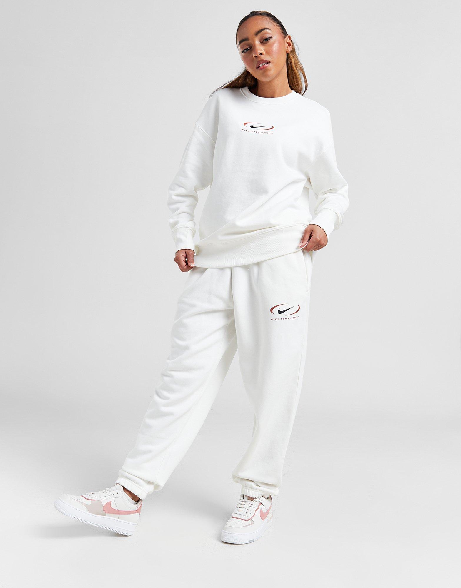 Dámské kalhoty NIKE KALHOTY  NSW PHNX FLC HR OS PANT PRNT FN7716-133 Béžová