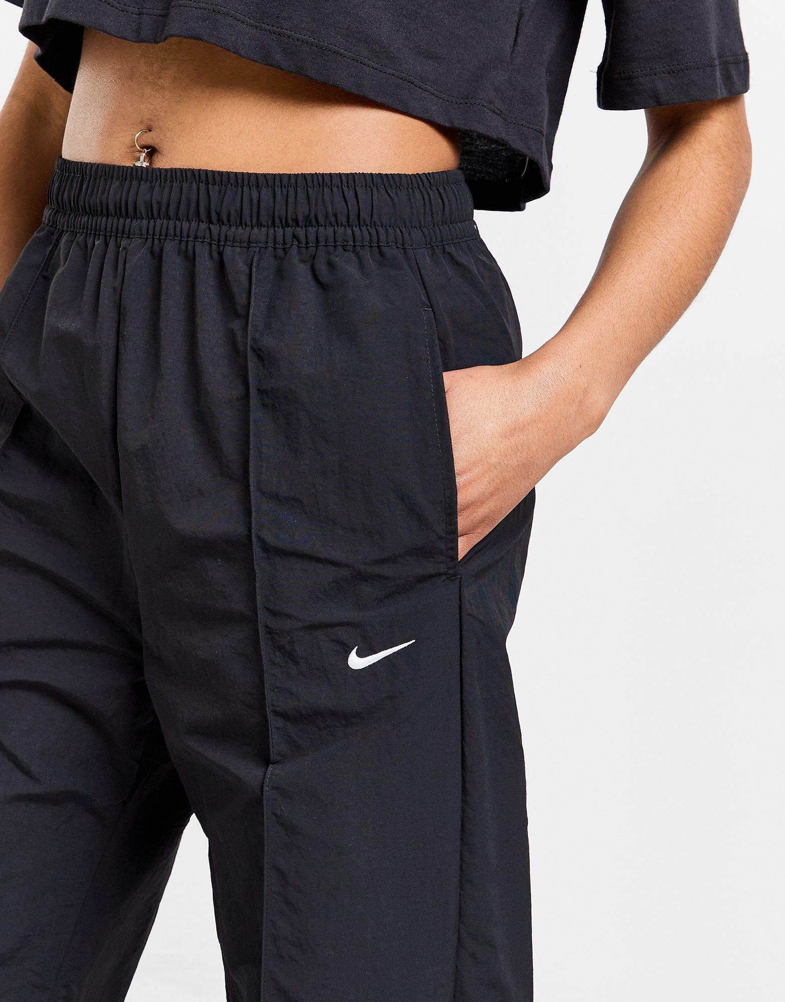 Moteriškos kelnės NIKE KELNĖS W NSW TREND WVN MR PANT FQ3588-010 Juoda