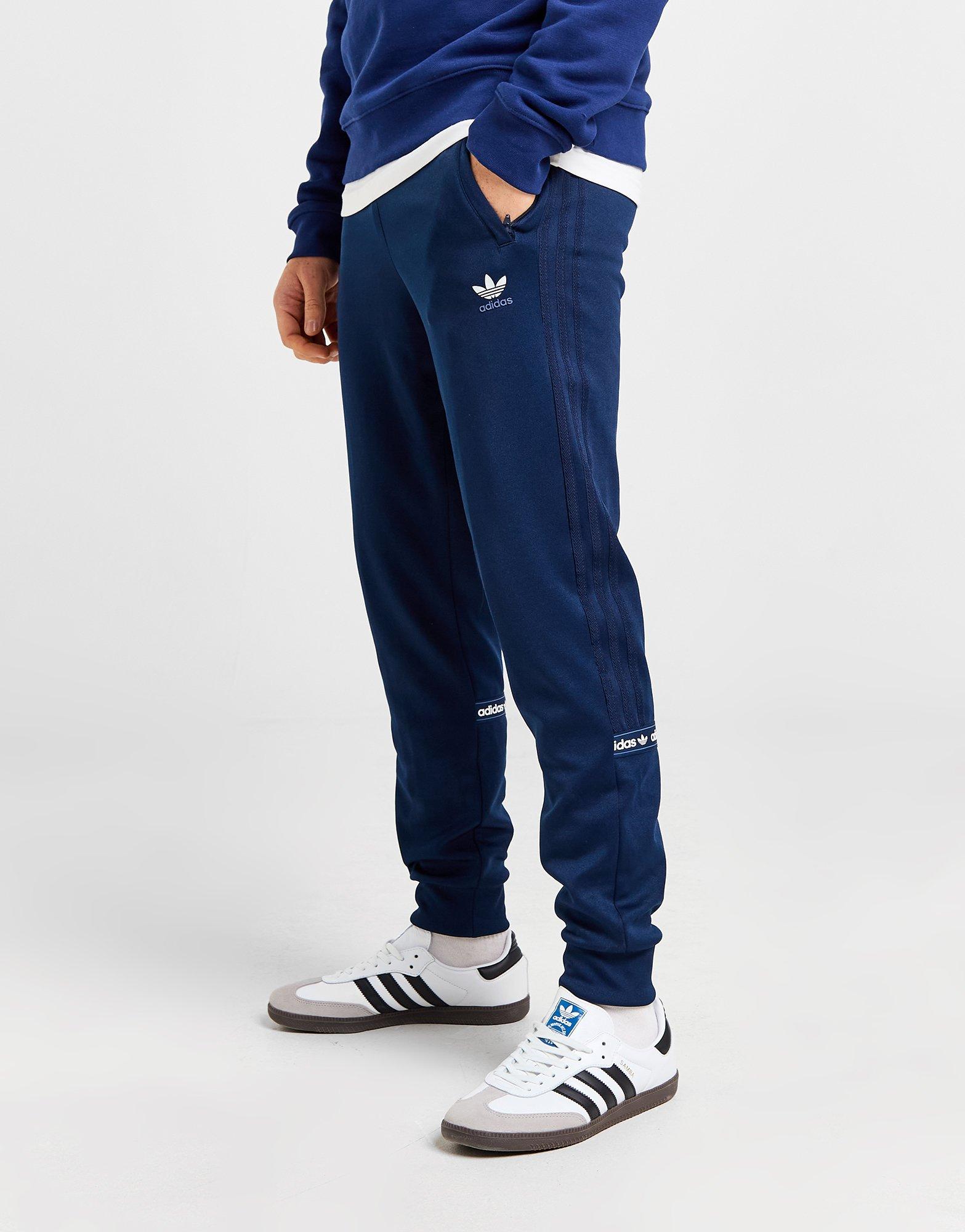 Muške hlače ADIDAS HLAČE NY TAPE PANT POLY TAPE IW6428 tamnoplava