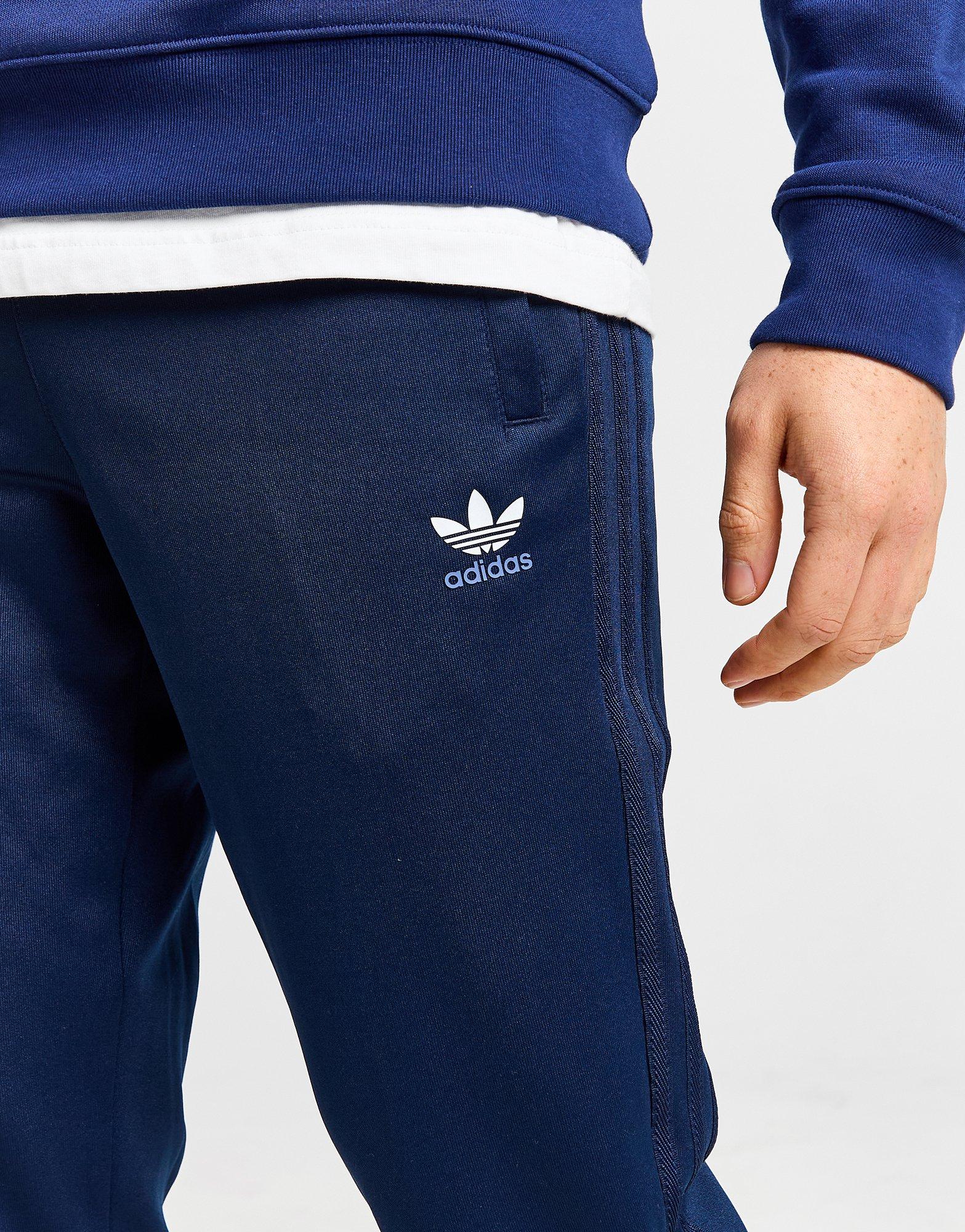 Muške hlače ADIDAS HLAČE NY TAPE PANT POLY TAPE IW6428 tamnoplava