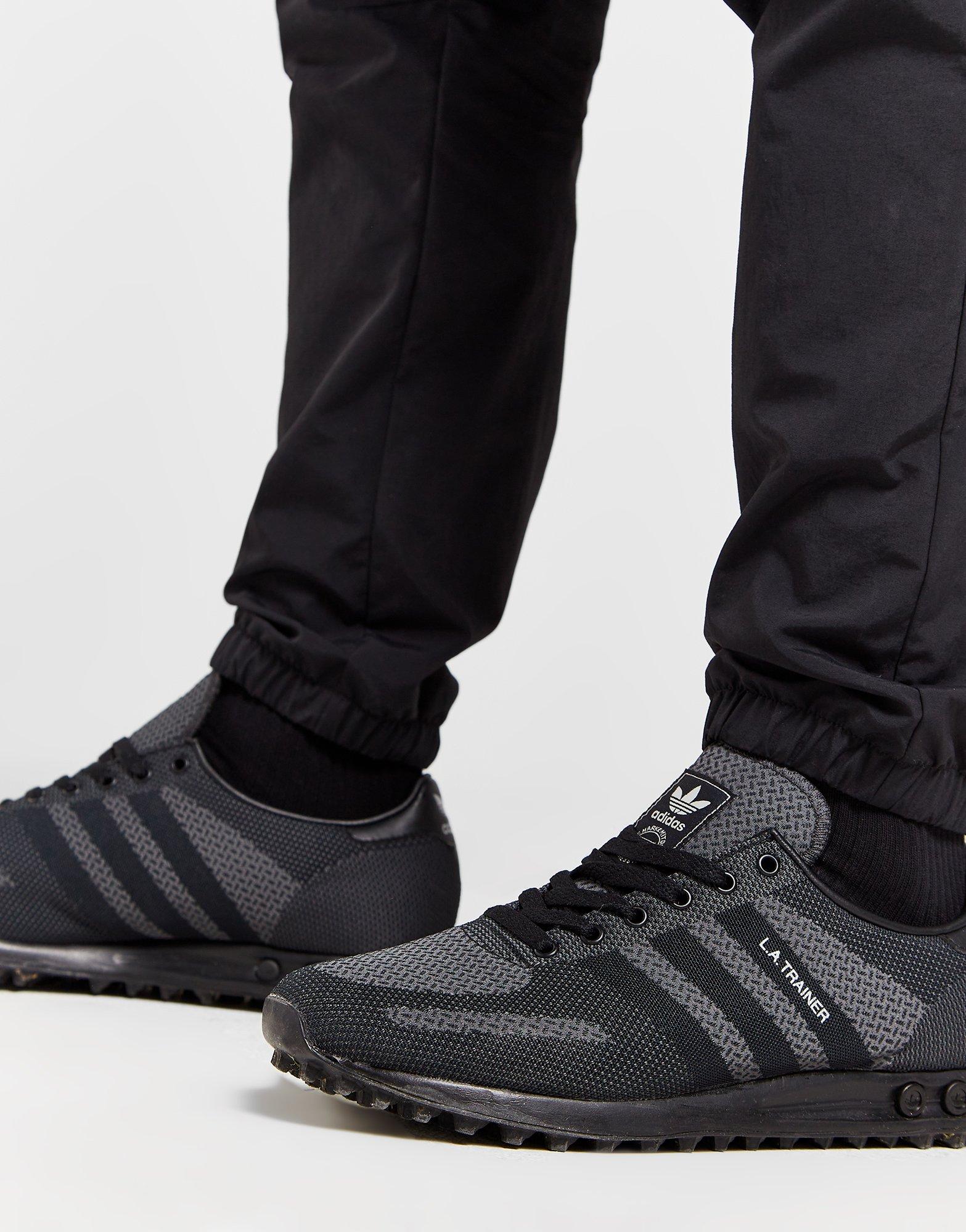 Muške hlače ADIDAS HLAČE CM WOVEN PANT GRAPHIC IS6113 crna