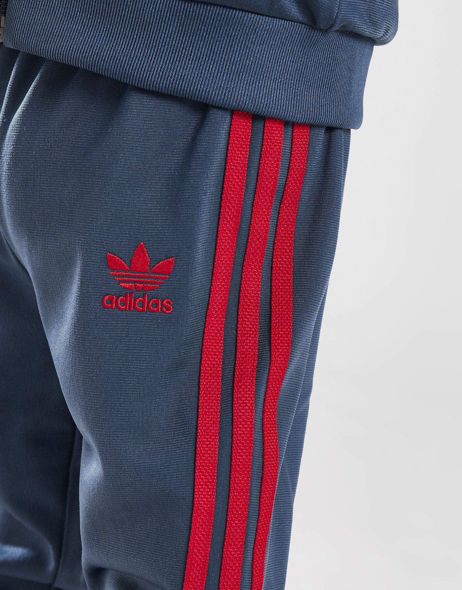 Vaikiški sportiniai kostiumai ADIDAS KOMPLEKTAS SST TRACKSUIT B IX3100 Tamsiai mėlyna