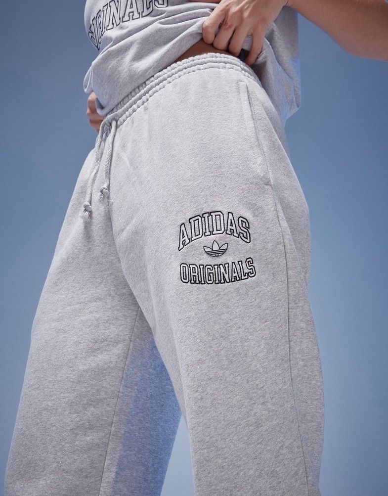 Dámske nohavice ADIDAS NOHAVICE  JOGGERS IZ0182 Sivá