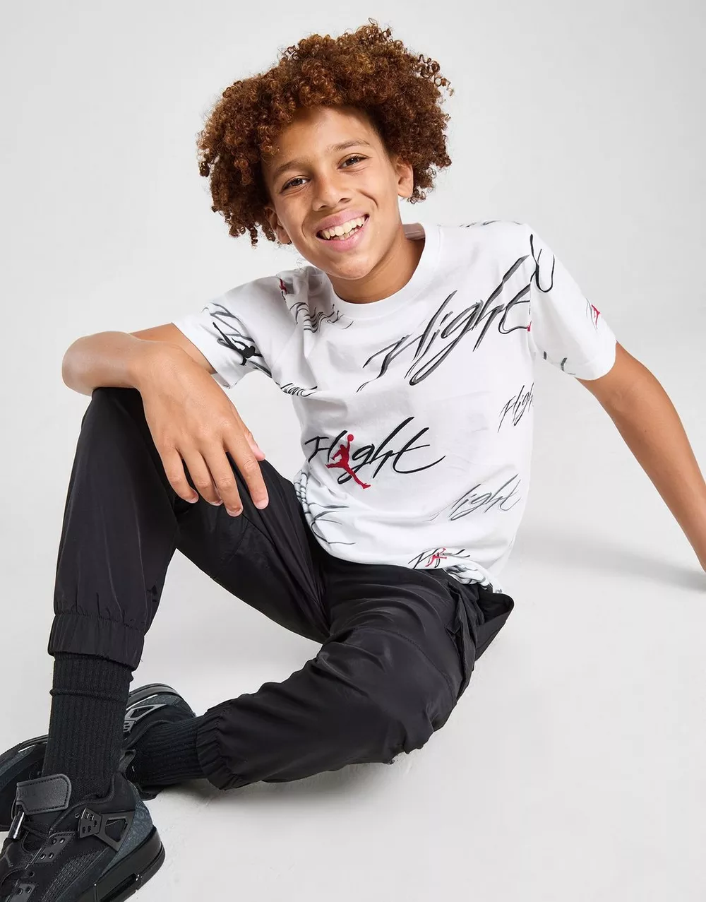 NikeHad JORDAN ФУТБОЛКА FLIGHT AOP TEE WT/BLK/RD B, фото 1 з 6