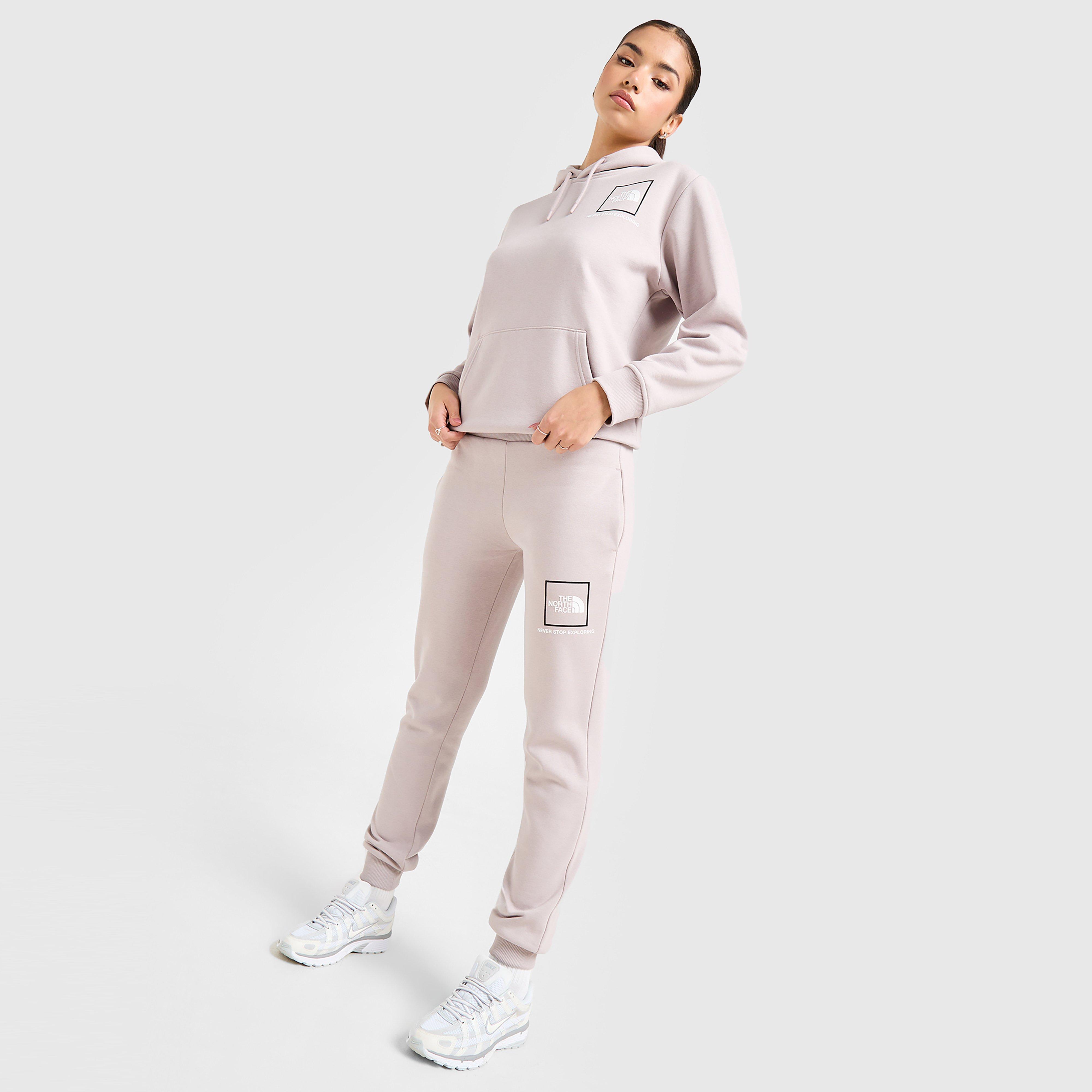 Pantaloni pentru femei THE NORTH FACE PANTALONI  OUTLINE JOGGER MOON/WH