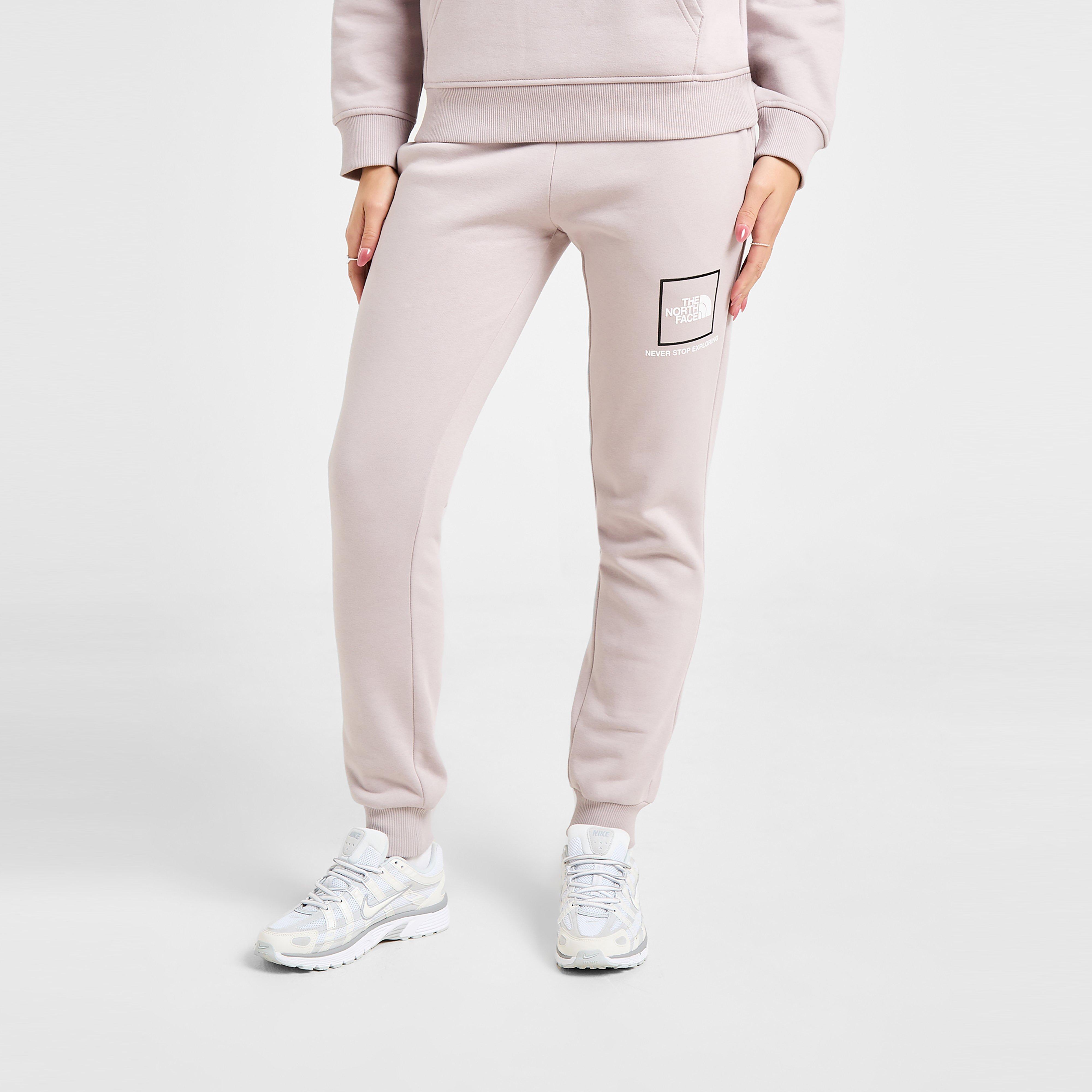 Pantaloni pentru femei THE NORTH FACE PANTALONI  OUTLINE JOGGER MOON/WH