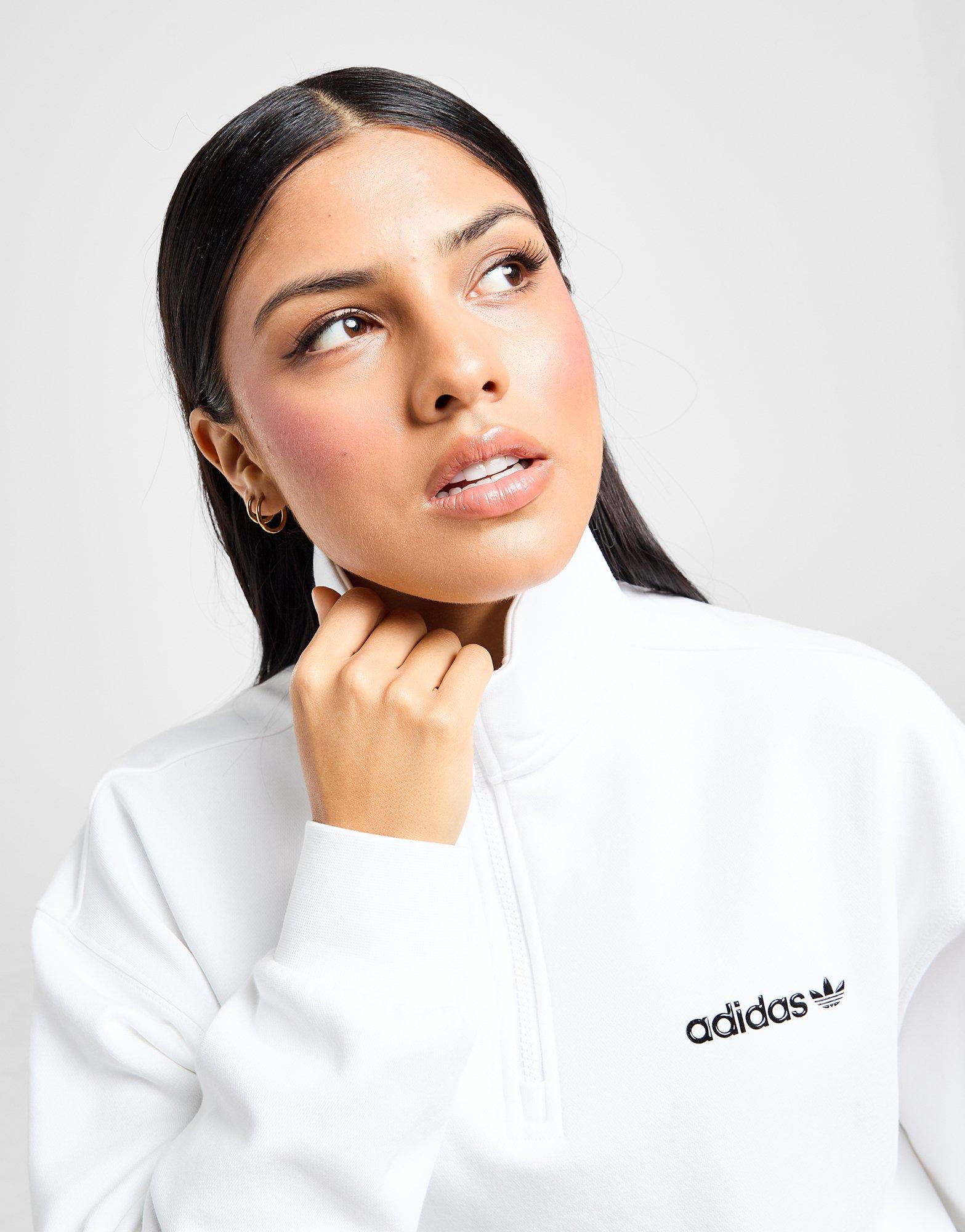 Moteriškas džemperis ADIDAS DŽEMPERIS UŽSEGAMAS SHINE BF 1/4 ZP WHT/BLK JD6334 Balta